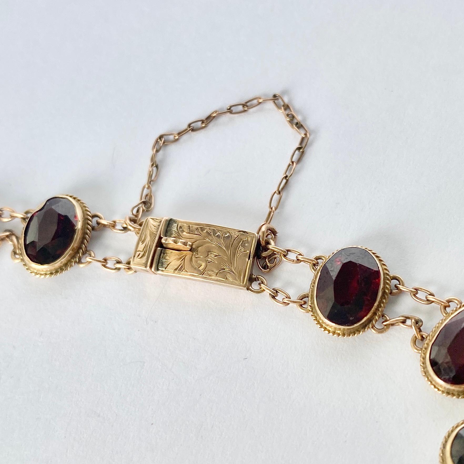 Set in this 9carat gold bracelet are 13 gorgeous red garnet stones. The stones are deep red and when the light hits the stones they have a bright glow. 

Length: 18.5cm
Stone Dimensions: 8x6mm

Weight: 8.1g