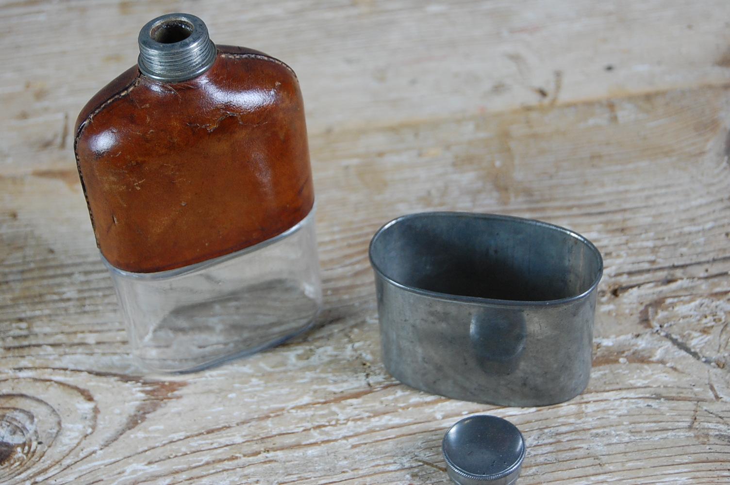 Charming Edwardian Gentlemans hip flask. Glass, pewter and leather. The leather has taken a warm patination. Generally used to enable the sportsman to take a nip or dram of their favourite tipple into the field, fits snugly into a pocket. Screw lid,