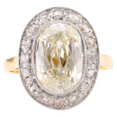 Edwardian GIA 5.02 Carat Cushion Diamond 18K Yellow Gold Cluster Ring
