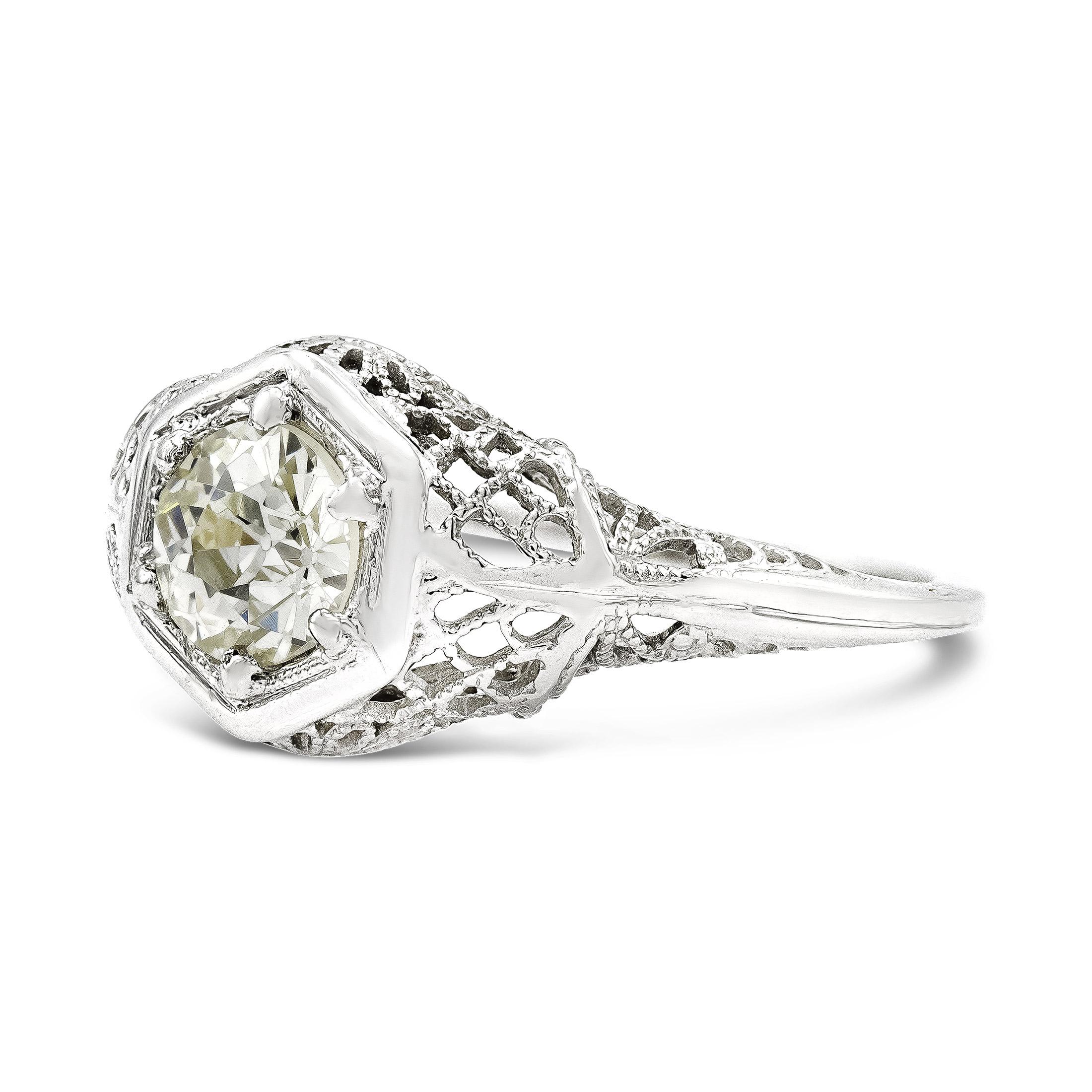 This romantic solitaire engagement ring is full of old-world charm. Our center old European cut diamond is quintessentially antique with her small crown and one of a kind faceting. We love the rope-like metalwork that wraps around the center setting