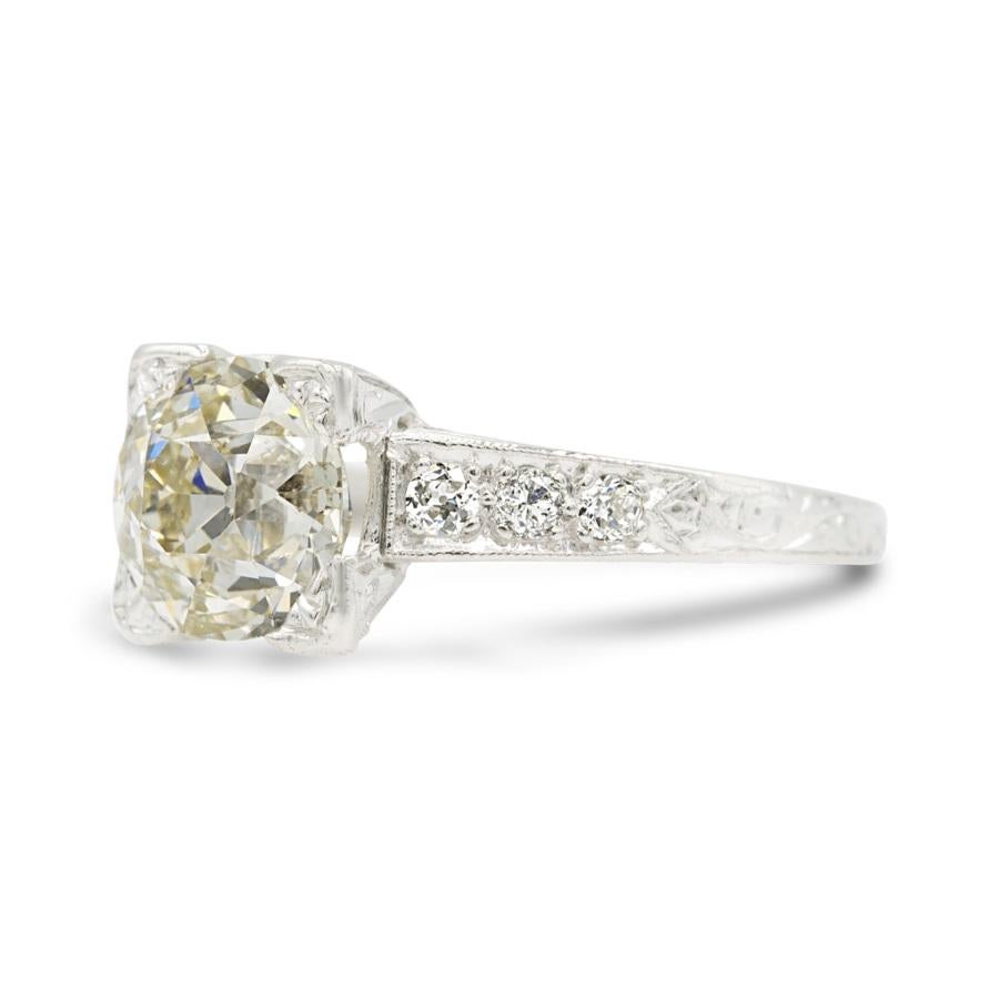 This lush 2.25 carat old European center is true old-world beauty, with a high crown and a small table. Centered in an Edwardian-era engagement ring, the diamond reflects so much light and brilliance from the square basket. Why we love it? The