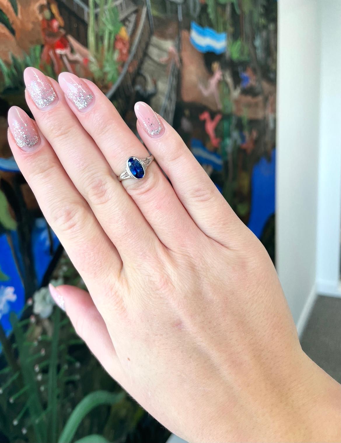 Antique, colorful and elegant. What else can you wish for? This is a gorgeous Edwardian sapphire ring. Wear a piece of antique 100 year old history on your finger. GIA certified as Ceylon sapphire, heated (#2211358645). Approximately 1.55 carats.