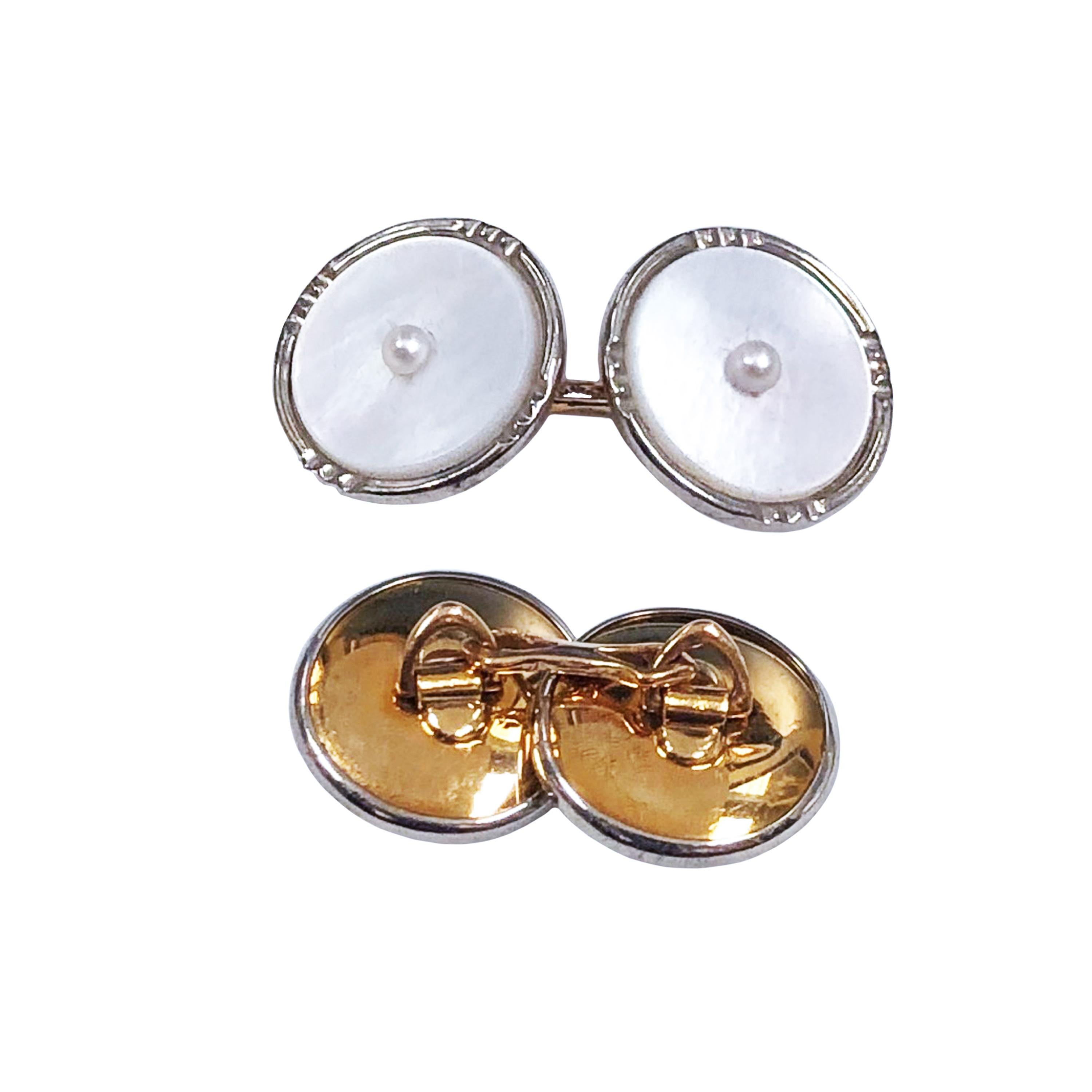 Circa 1920s 10K White and Yellow Gold Tuxedo Shirt Stud Dress Set, this set comprising of Cufflinks, Shirt Studs and Vest Suds is finished with White Mother of Pearl and each piece is centrally set with s Pearl. The set comes in the original fitted