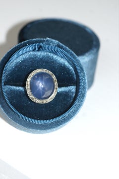 Edwardian Gold and Platinum Cluster Ring with 35cts Ceylan Star Sapphire Caboch