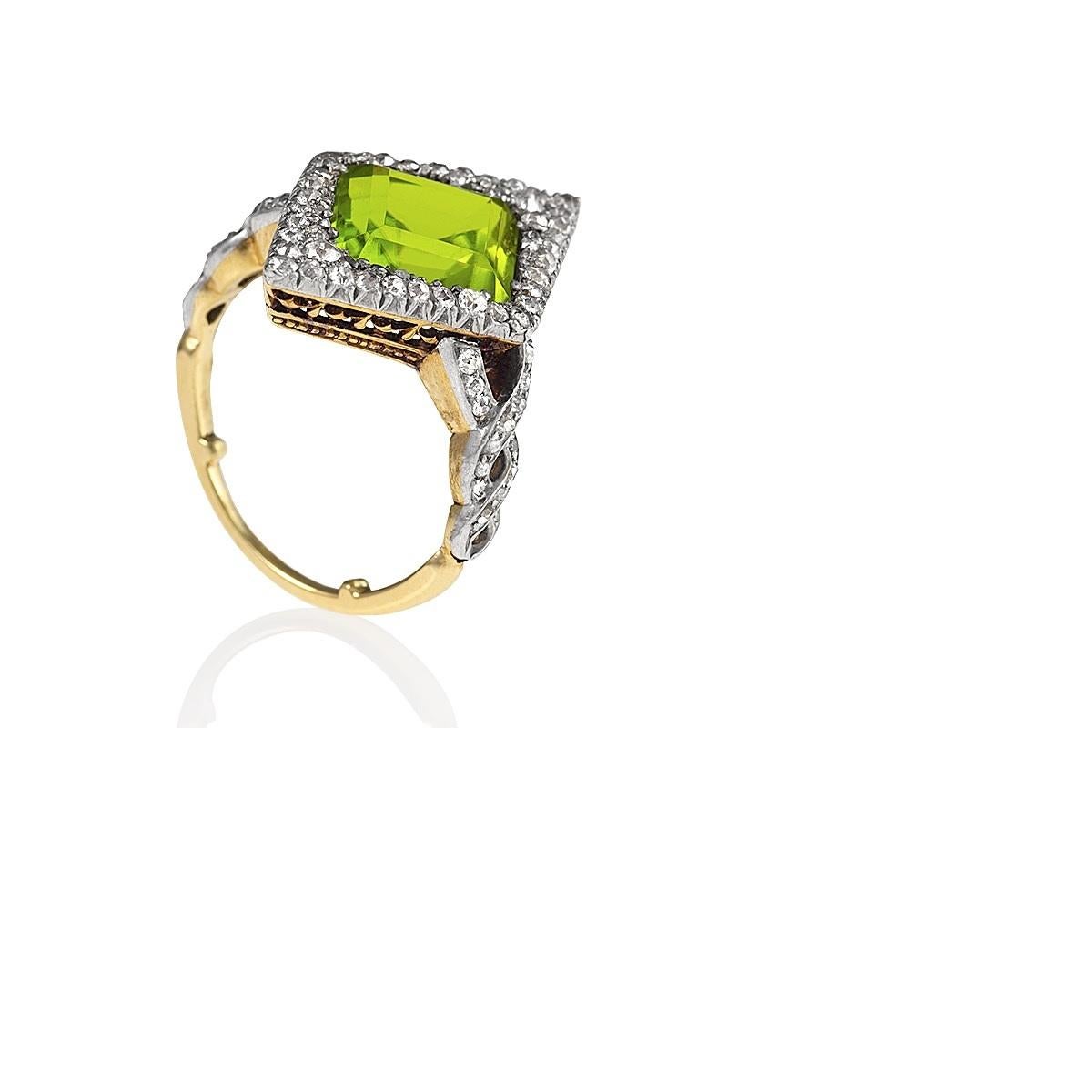 An Edwardian 18 karat gold and platinum ring with peridot and diamonds. This ring centers on a marquise-shape  peridot with an approximate weight of 4.15 carats, and 70 old European-cut diamonds with an approximate total weight of 1.00 carats. 