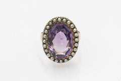 Edwardian gold ring with amethyst and natural pearls, 1911-1912.