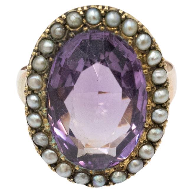 Edwardian gold ring with amethyst and natural pearls, 1911-1912.