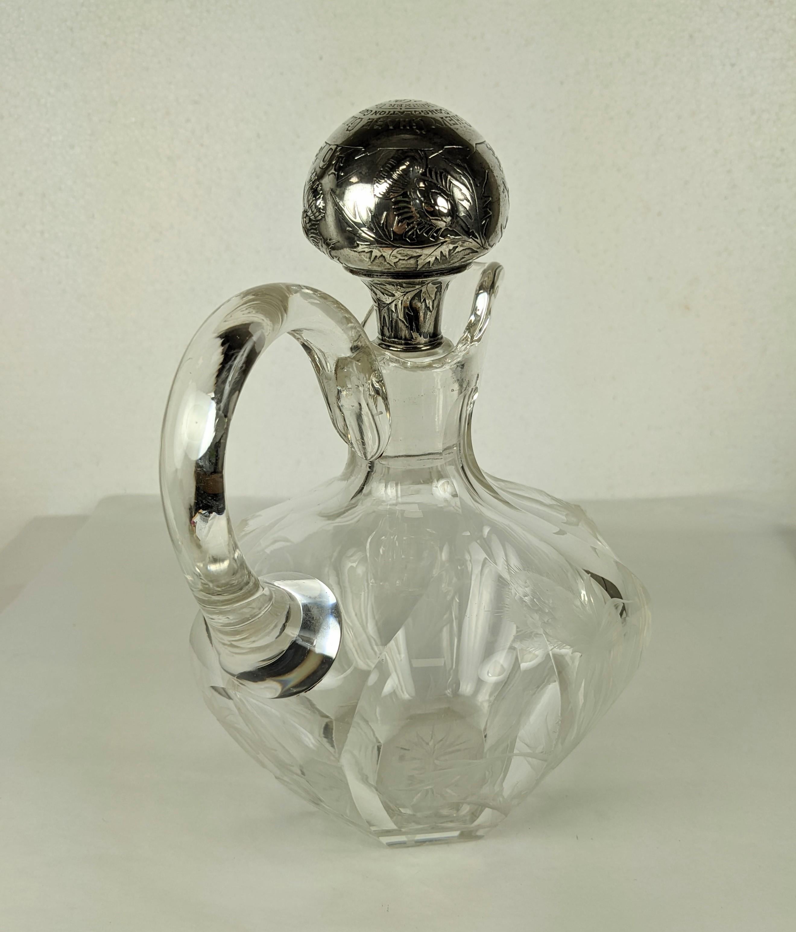 Early turn of the century decanter by Gorham with cut crystal base and elaborate sterling stopper which reads..