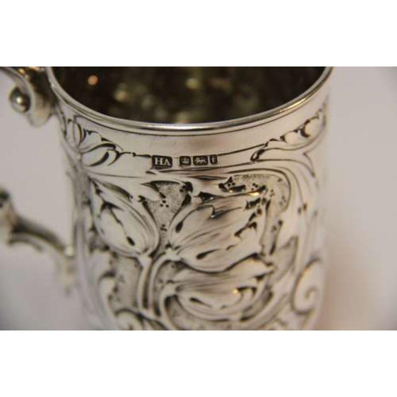 Edwardian silver tankard

This high quality hall marked silver tankard was made in Sheffield 1901/2.
It has good proportions and weight and has bold raised and engraved floral and foliate decoration to both the body and the handle. Monogrammed