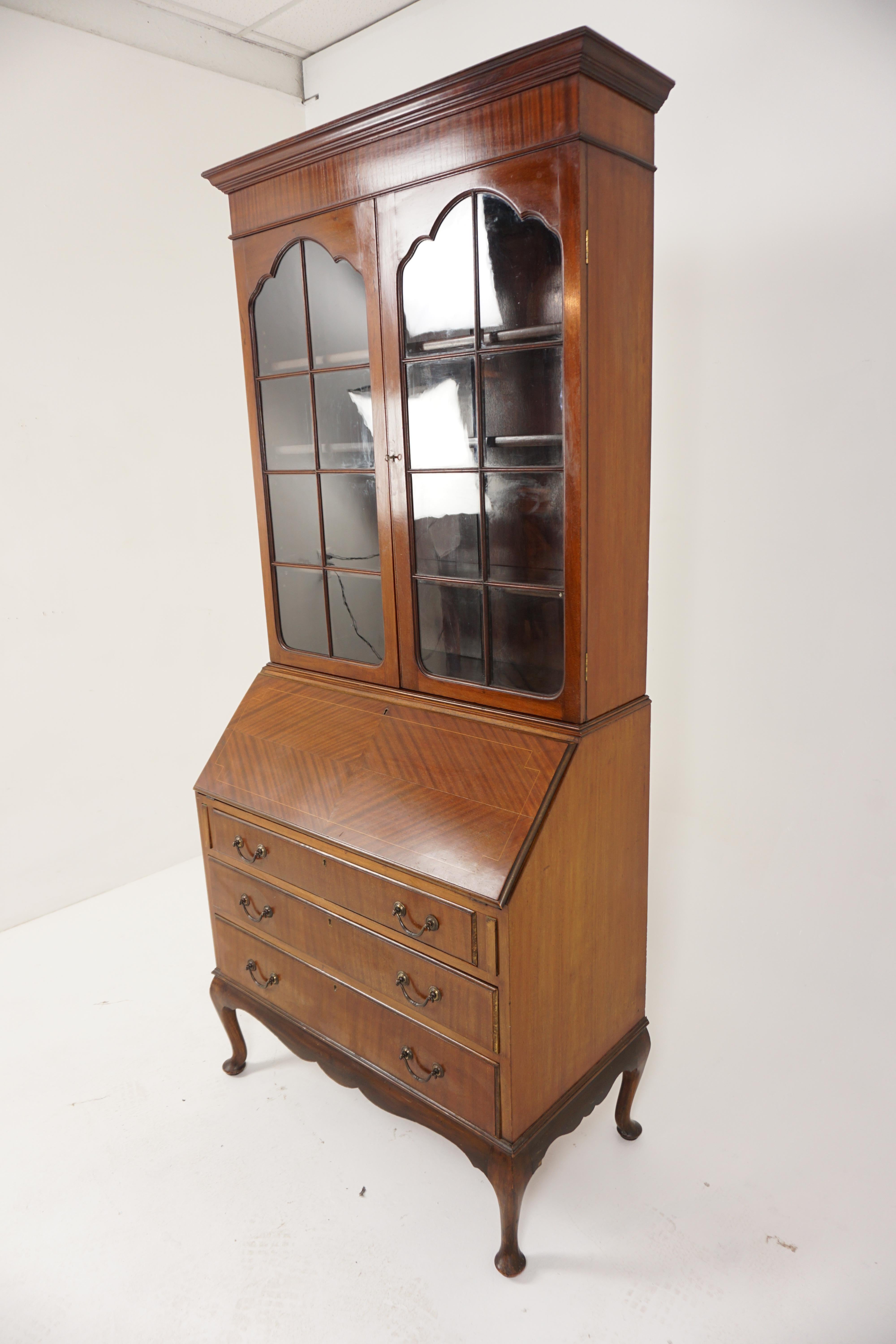 Edwardian inlaid bureau bookcase, secretaire, Scotland 1910, B2940

Scotland 1910
Solid walnut and veneer
Original finish
Cornice on top
Pair of original glass doors with moulding on the front 
Open to reveal three adjustable shelves
With