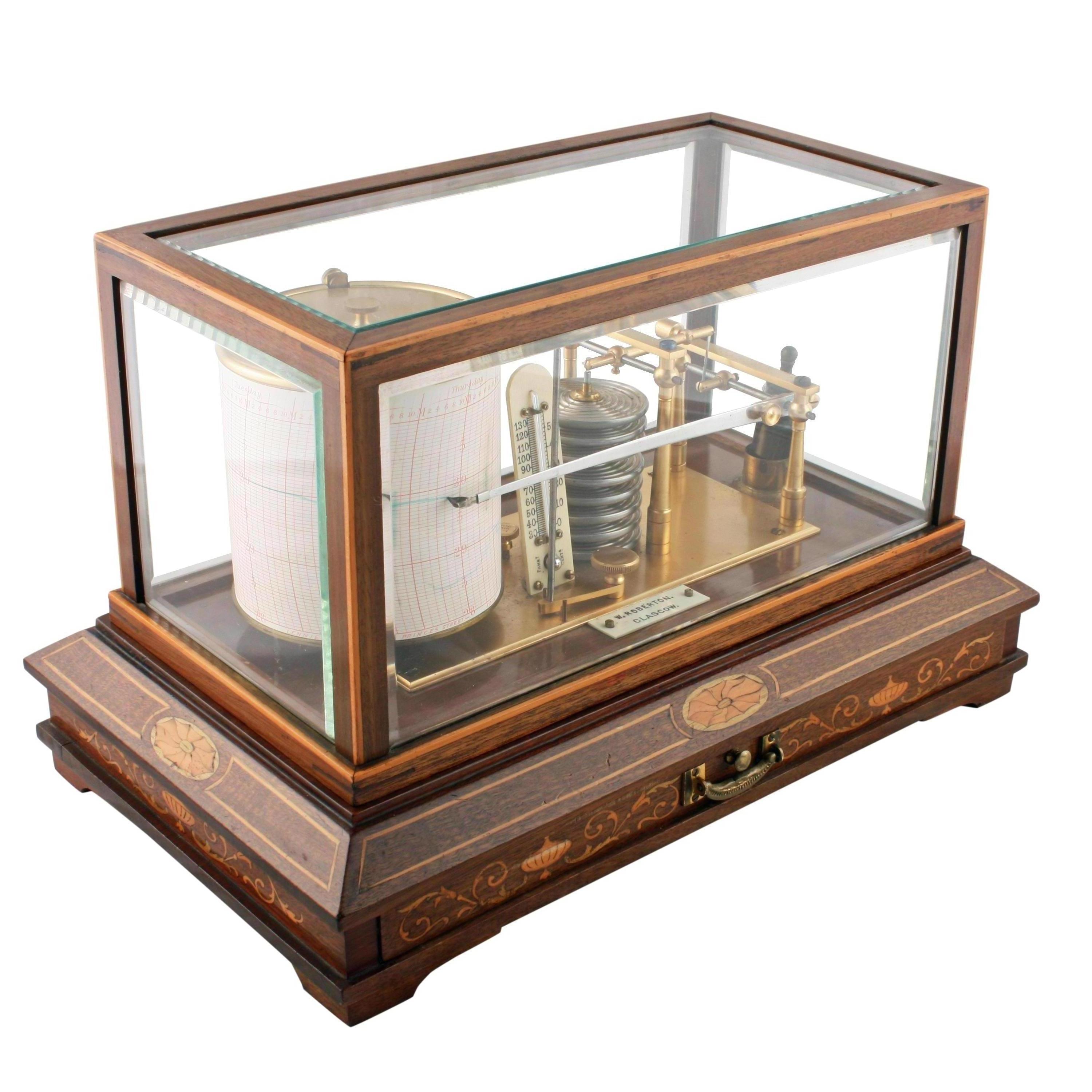 Edwardian Inlaid Mahogany Barograph


An early 20th century Edwardian barograph and thermometer in an inlaid mahogany case.

The barograph has a clock work revolving drum which holds a recording chart on which the fluctuations in barometric