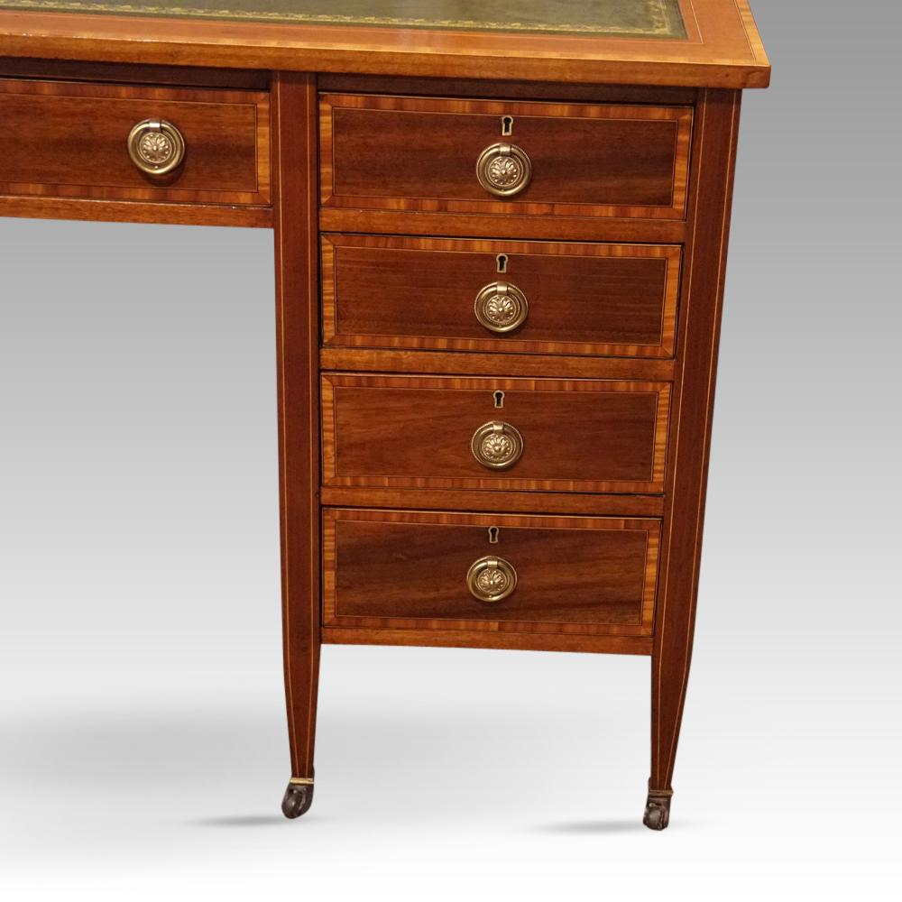 Edwardian inlaid mahogany desk
This Edwardian inlaid mahogany desk was made circa 1910, the ‘age of elegance.’
The desk with the green gilt tooled writing surface with the mahogany satinwood banded edge.
To the right are the flight of 4 graduated