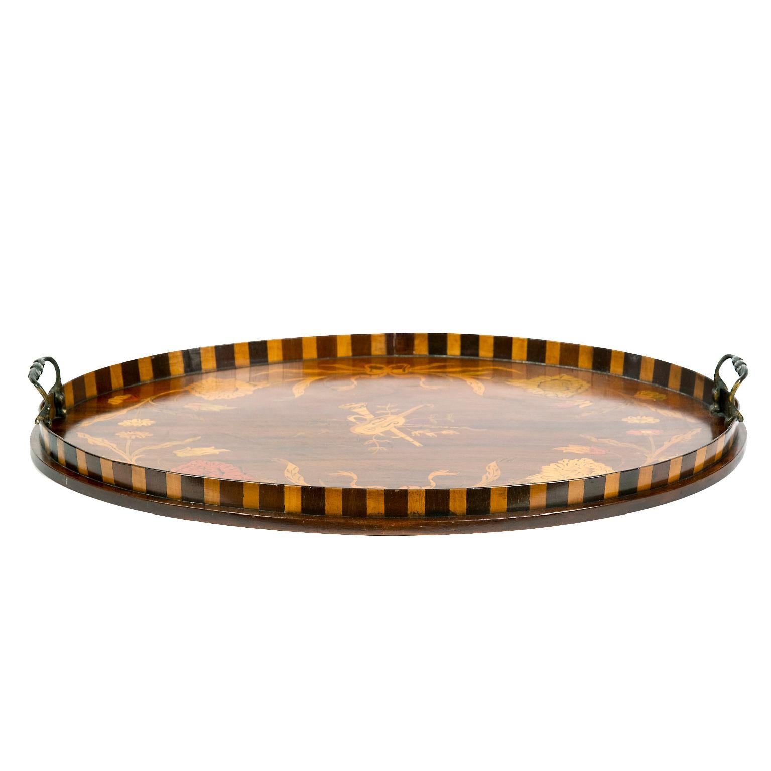 This stunning and intricately inlaid oval wood tray is both functional and beautifully decorative! It is a work of art with its flowers, musical theme center and contrasting wood boarder.