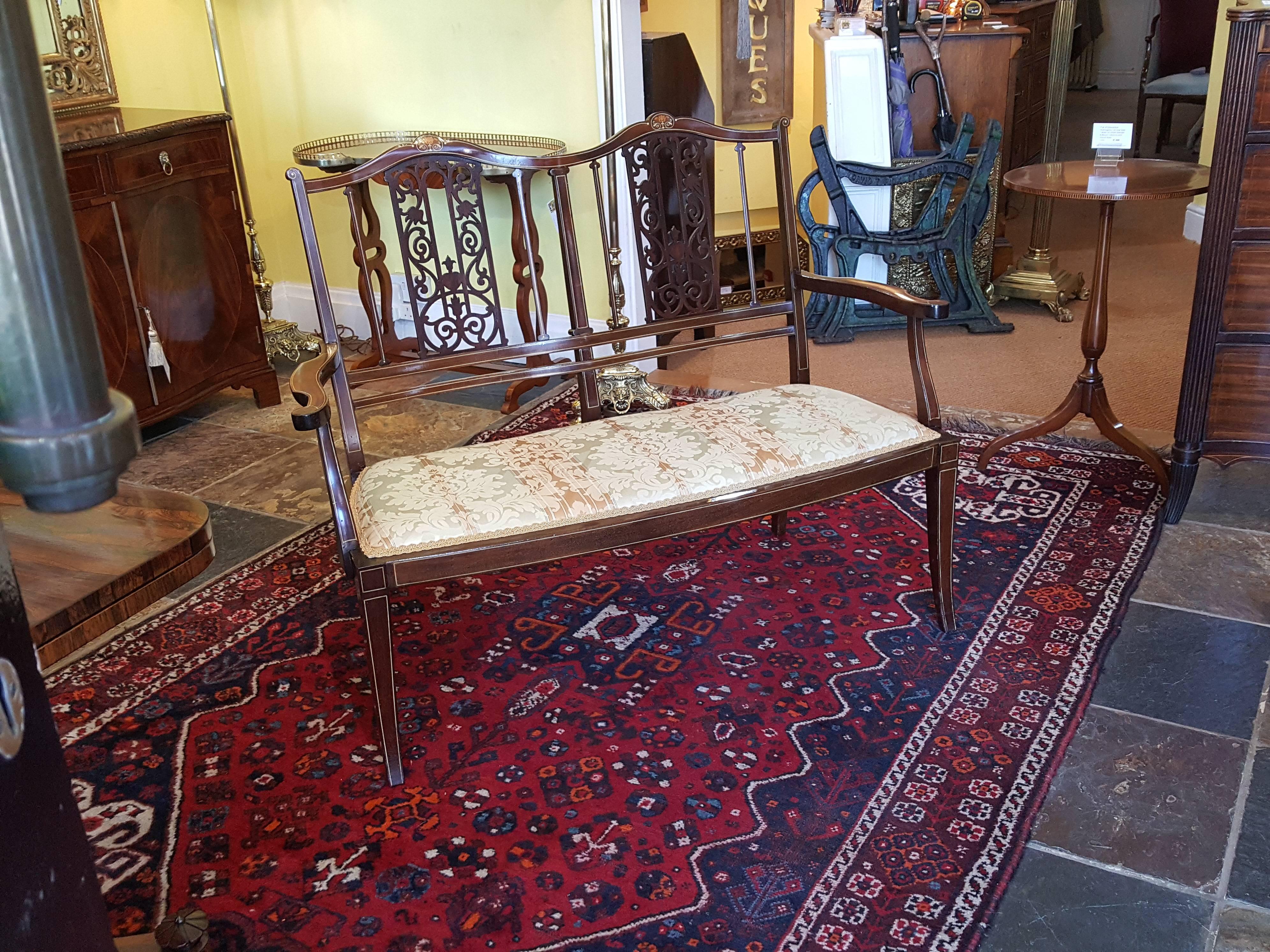 Edwardian inlaid and fret worked mahogany two-seat settee
Measures: 46