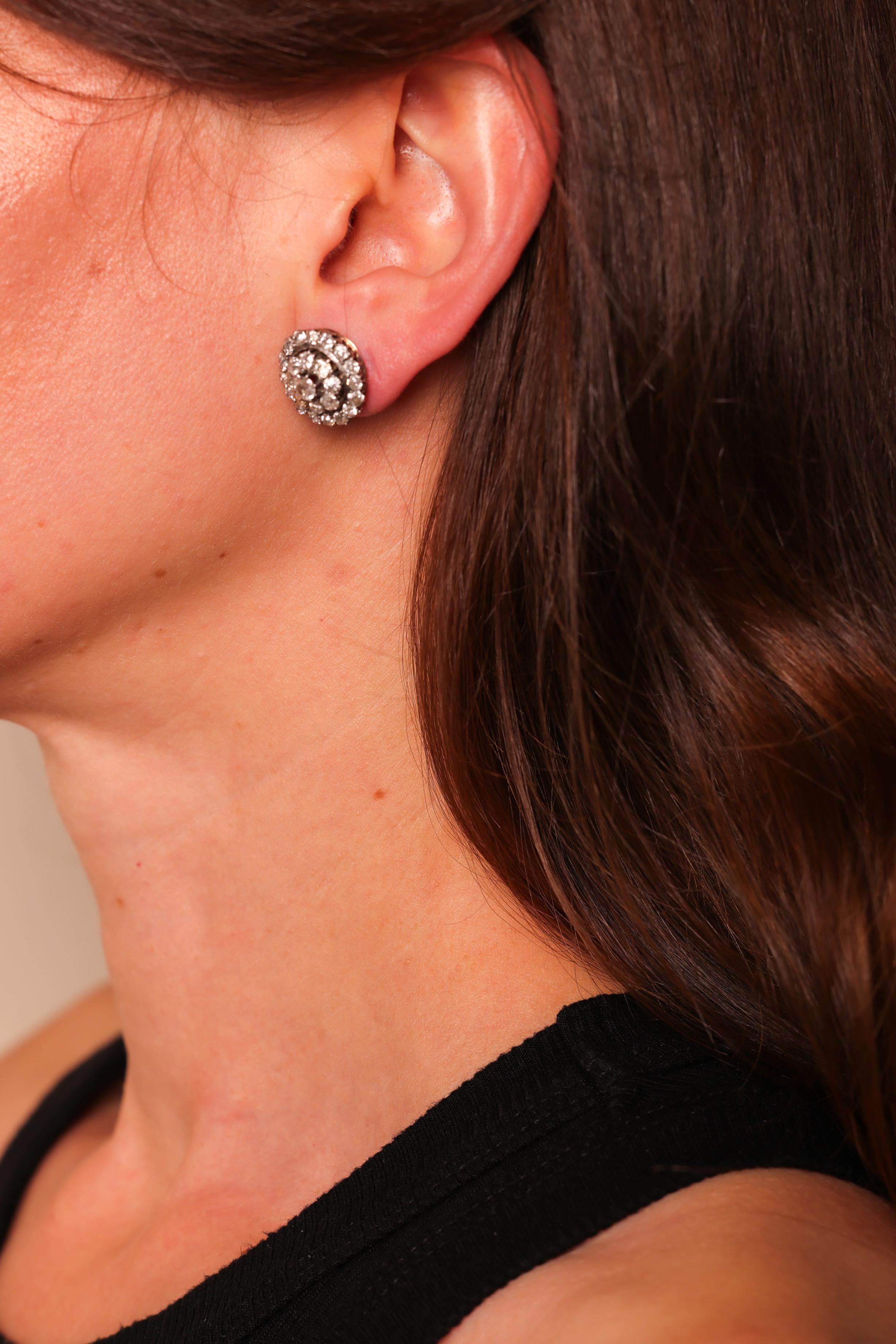 Center Stone: 50 Diamonds
Cut: Old Mine Cut
Weight: Approximately 5 Carats
Color: J
Clarity: SI
Metal: 18K Yellow and White Gold
Era: Modern
Circa: 2020s in The Style of Edwardian
Size: 5/8 inches diameter
Gram weight: 8.77


These modern earrings,