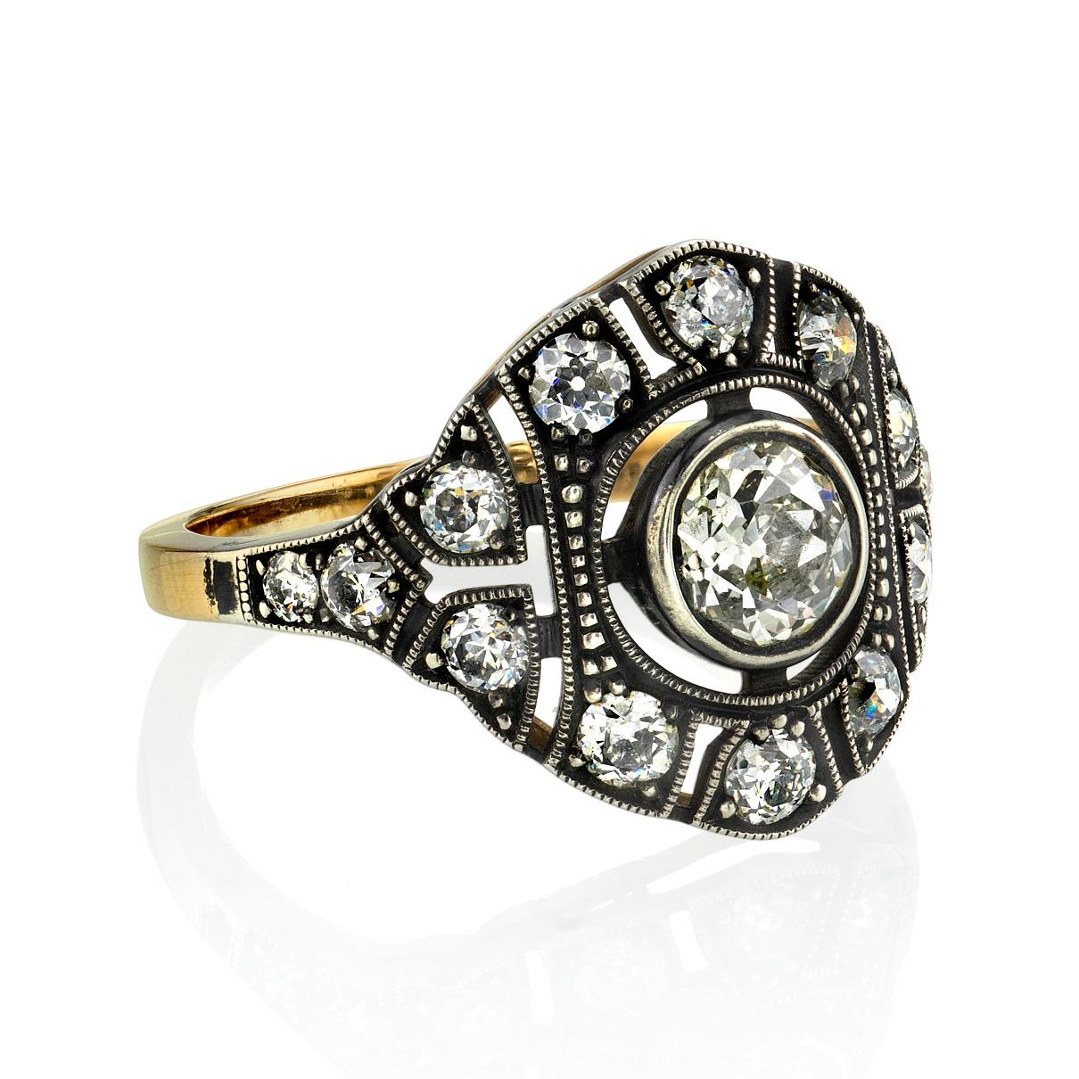 0.59ct N/VS2 GIA certified old European cut diamond set in a handcrafted 18k yellow gold and silver mounting. A two toned Edwardian inspired design that features a low profile. Ring is currently a size 6 and can be sized to fit. 