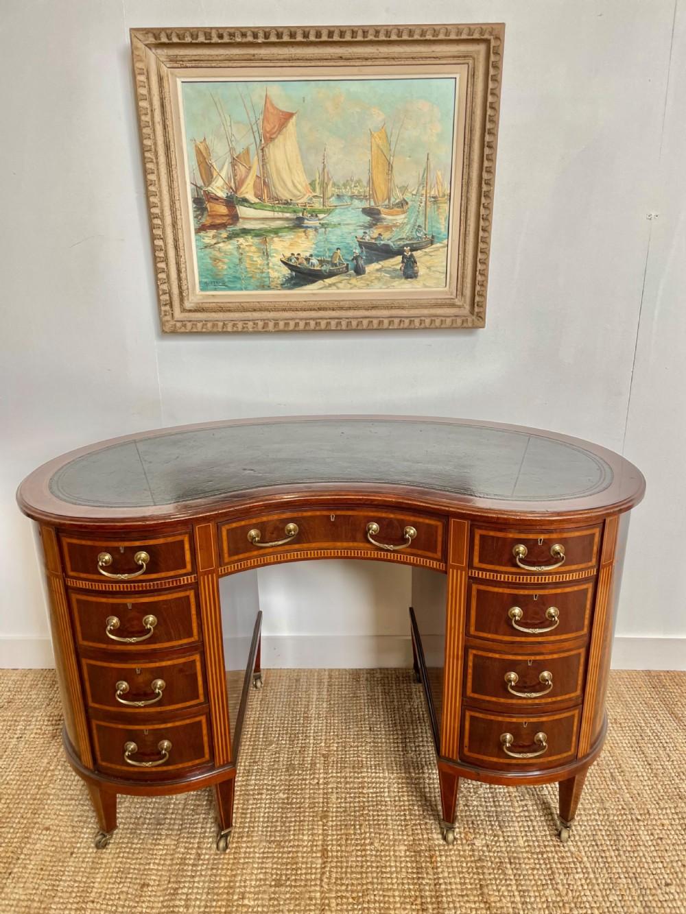 Very good quality early 20th century mahogany and inlaid writing desk
English circa 1900 with original brass handles , castors and leather insert
Having 9 mahogany lined drawers , this a very practical neat sized desk , would all so make a great