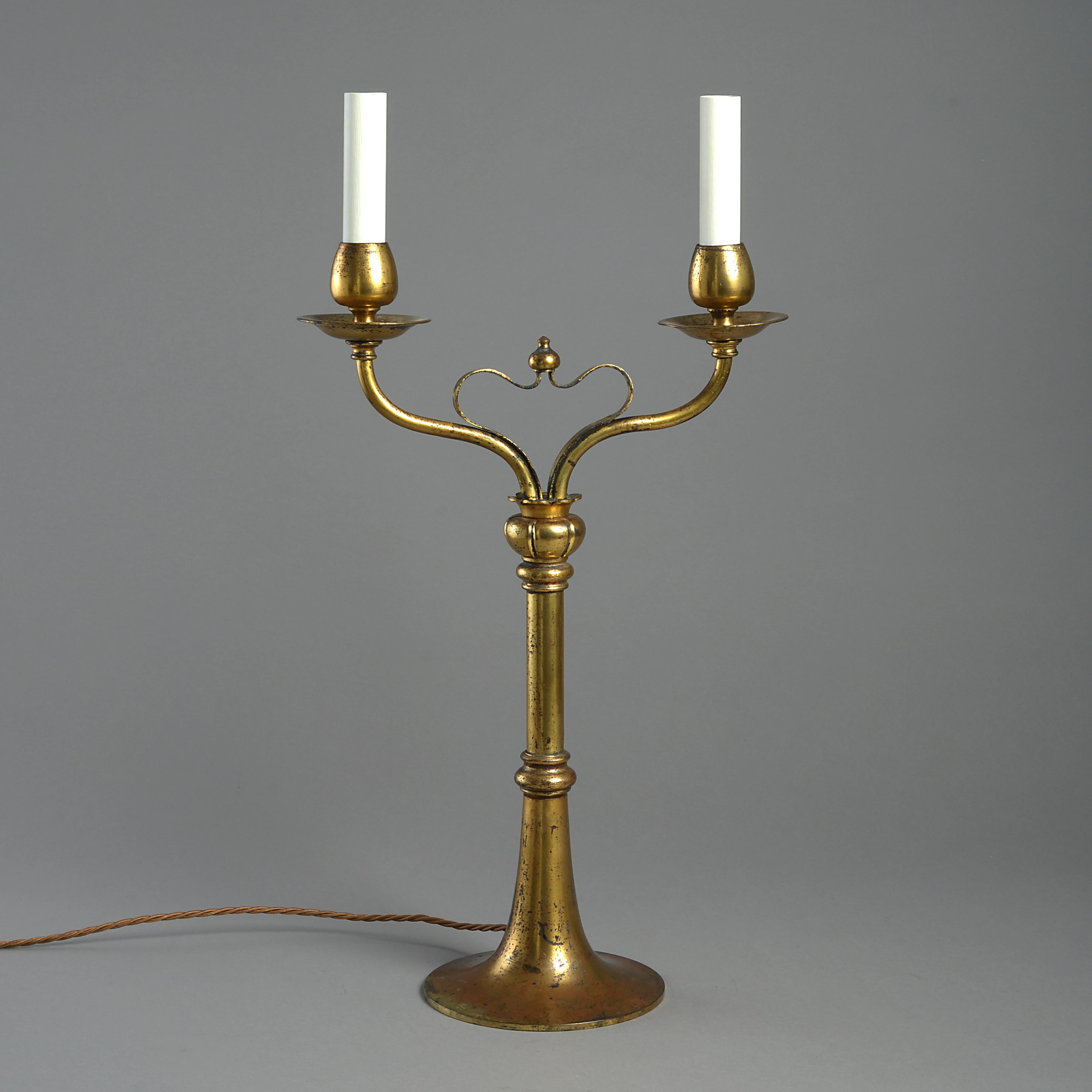 A pair of Edwardian lacquered brass candelabra, circa 1900.

Provenance
Mary, Duchess of Roxburghe, West Horsley Place, Surrey.