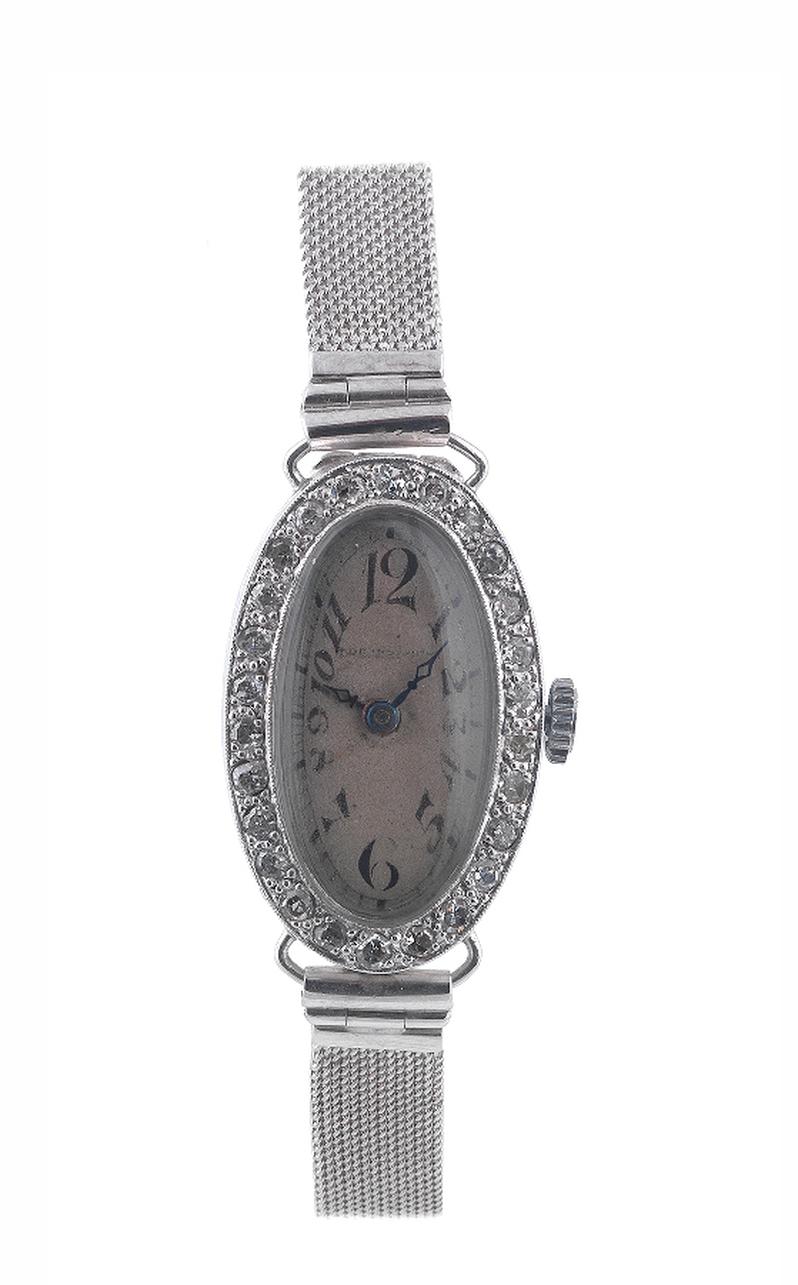 An Edwardian ladies platinum and diamond cocktail wristwatch, the oval dial with arabic hours and spade hands, the bezel inset with diamonds, with 9ct gold woven mesh strap, dial diameter: 17 cm, total weight: 17 g approx.
