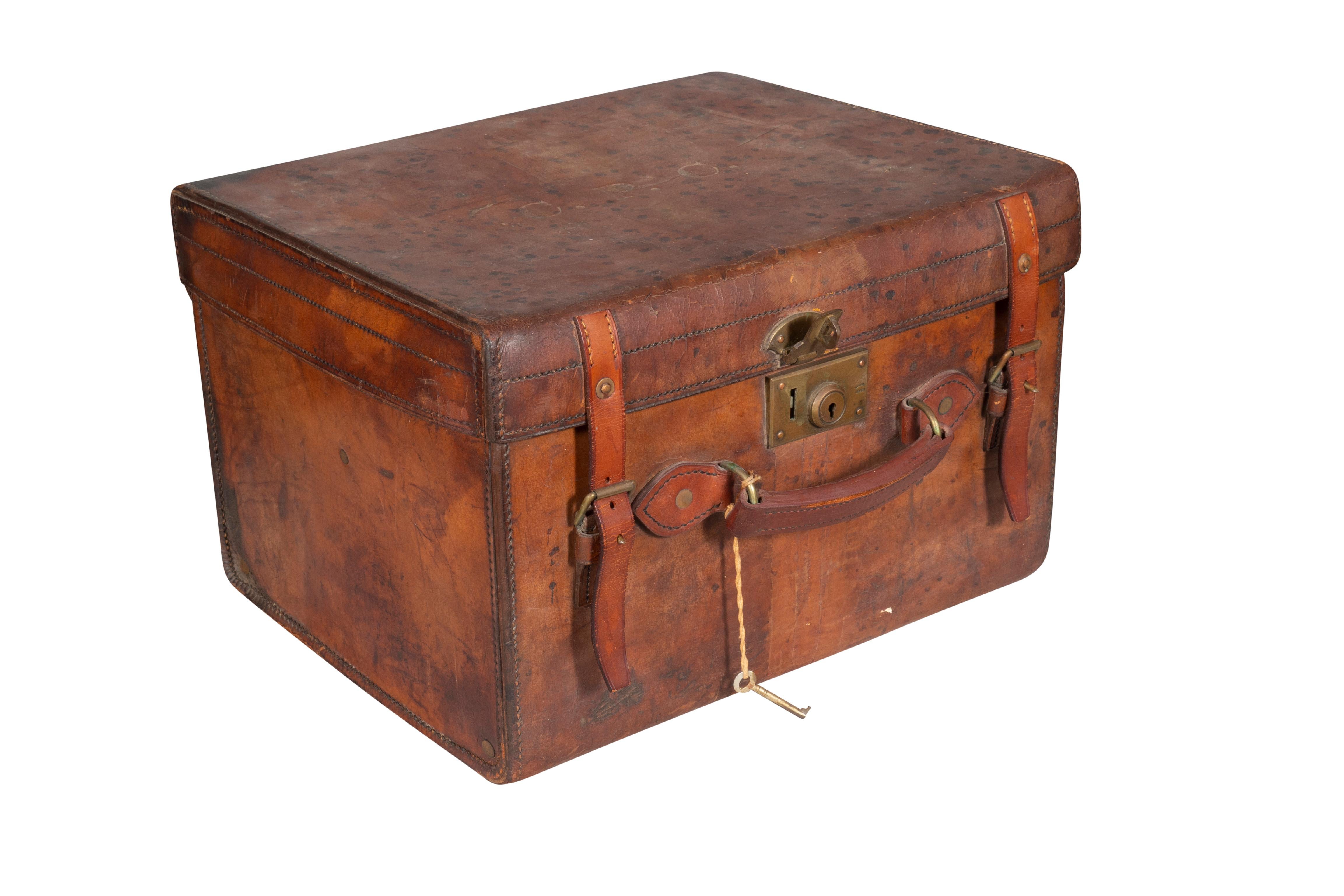 Brown leather box with a beaver top hat . Red leather interior. From a Hamilton Massachusetts estate.