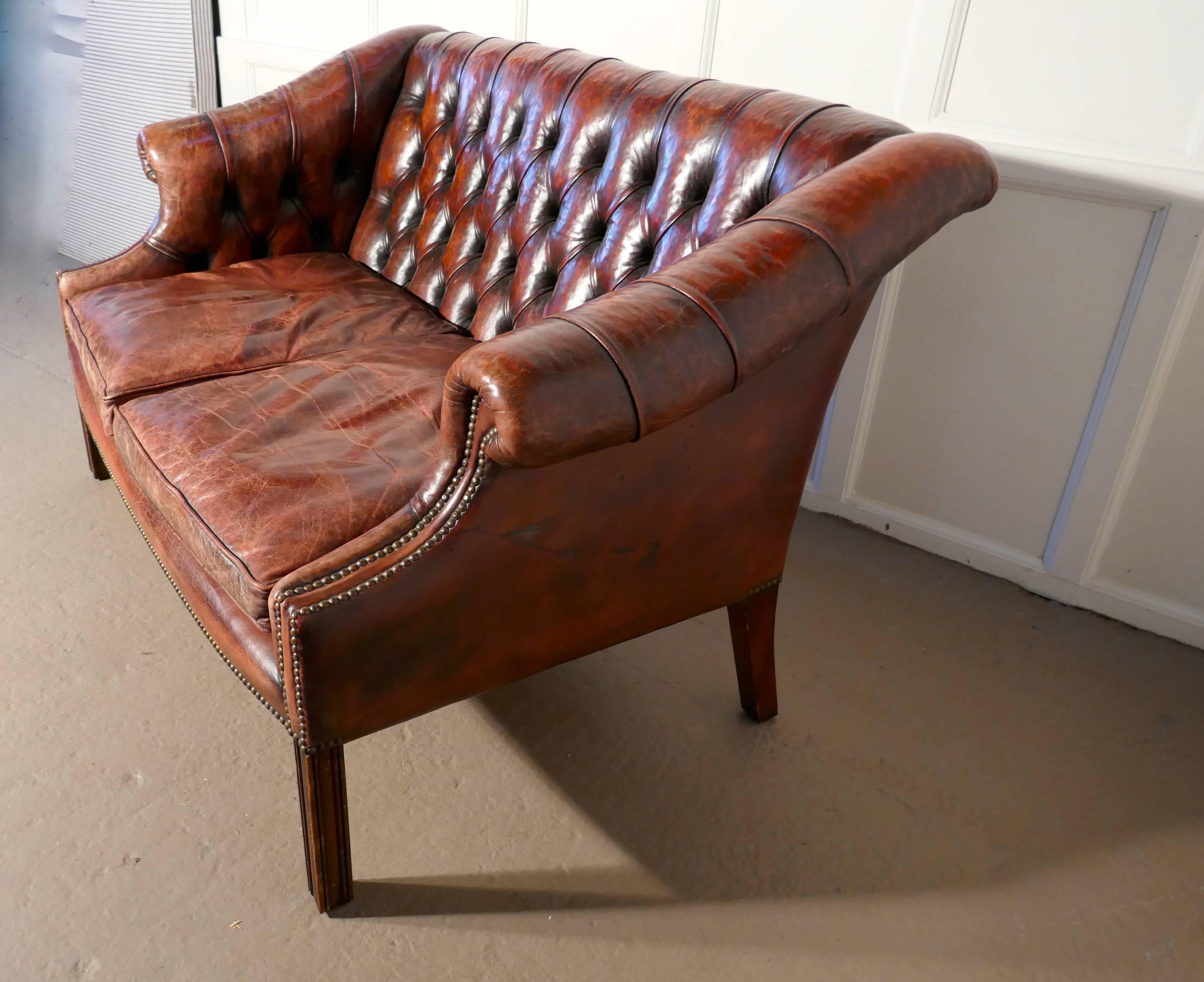 Edwardian leather two-seat library Chesterfield settee

This settee is the ultimate in vintage Country House Chic, it has a delightful neat shape, and the leather upholstery is original with the great character and softness that can only be