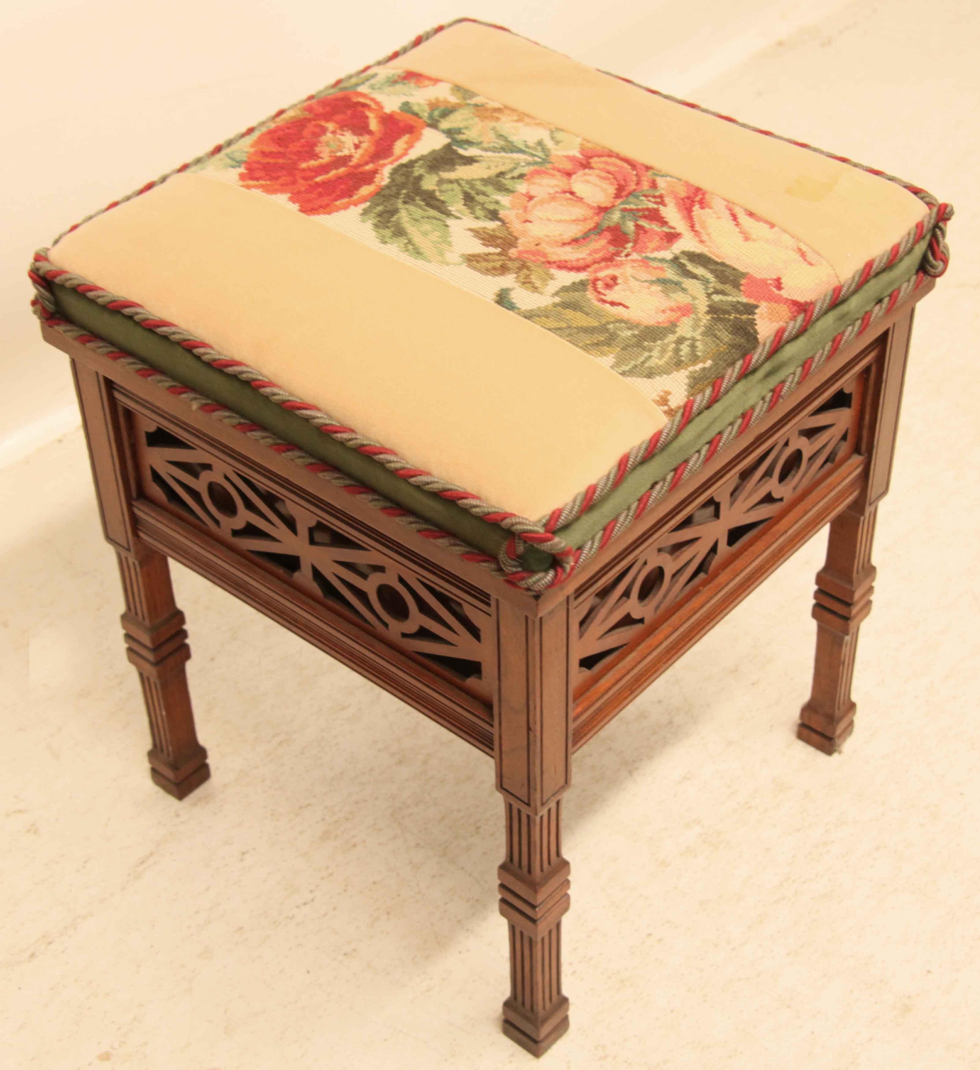 Edwardian lift top stool,  the top with vertical needlepoint floral design flanked by light beige fabric, top lifts up, ideal for piano music storage.  The edge of the top has red and gray twisted cording with green velvet in between.  All four