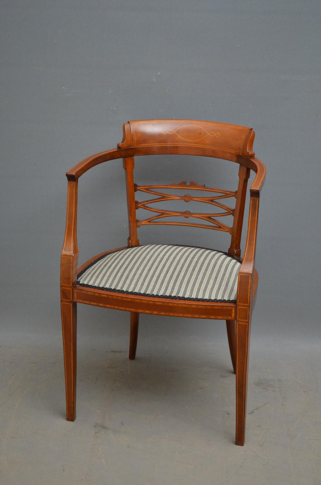 Sn4451 Edwardian inlaid elbow chair, having shaped and inlaid top rail with string inlaid arms and splats below, all standing on slender legs terminating. This antique occasional armchair retains its original color, finish and patina with newly