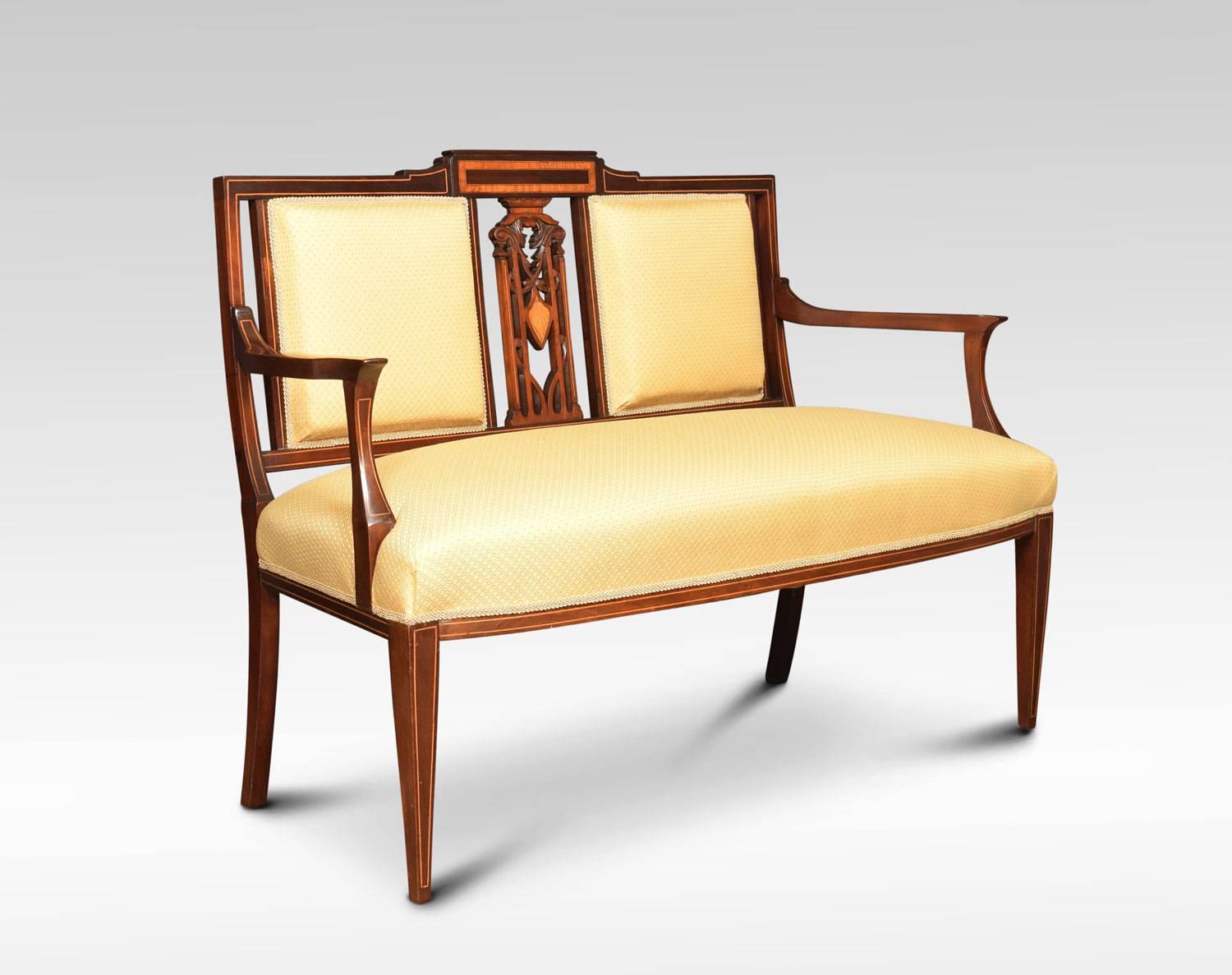 Edwardian mahogany and satinwood inlaid settee, with twin upholstered back panels flanking an intricate pierced splat. The upholstered seat flanked by out swept arms. All raised up on strung square tapering legs.
Measure: Height 35.5 inches height