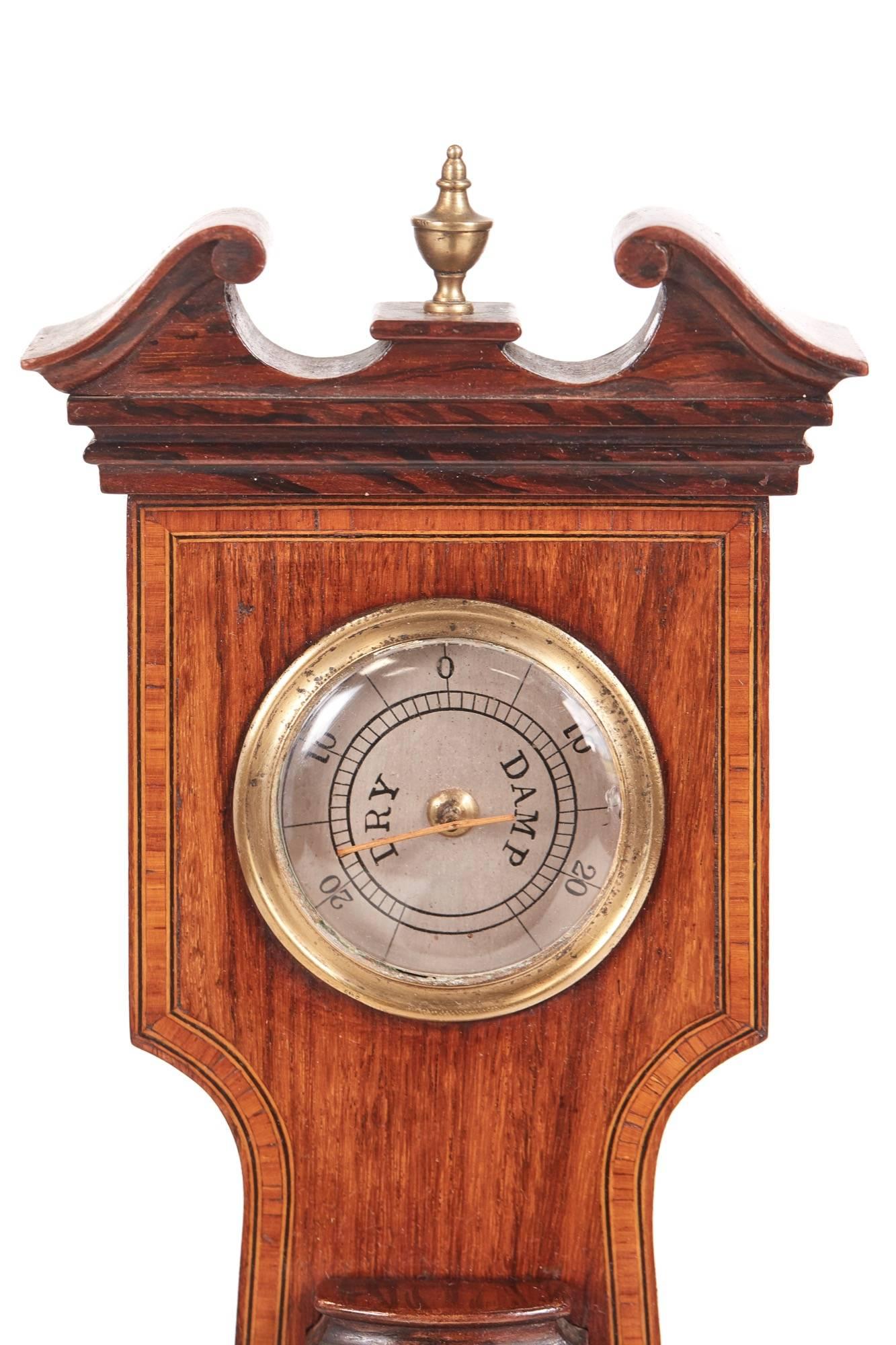 Edwardian crossbanded mahogany aneroid banjo barometer having a six inch silvered dial with and long thermometer and hygrometer above spirit level below
Lovely color and condition
Working order
Measures: 9