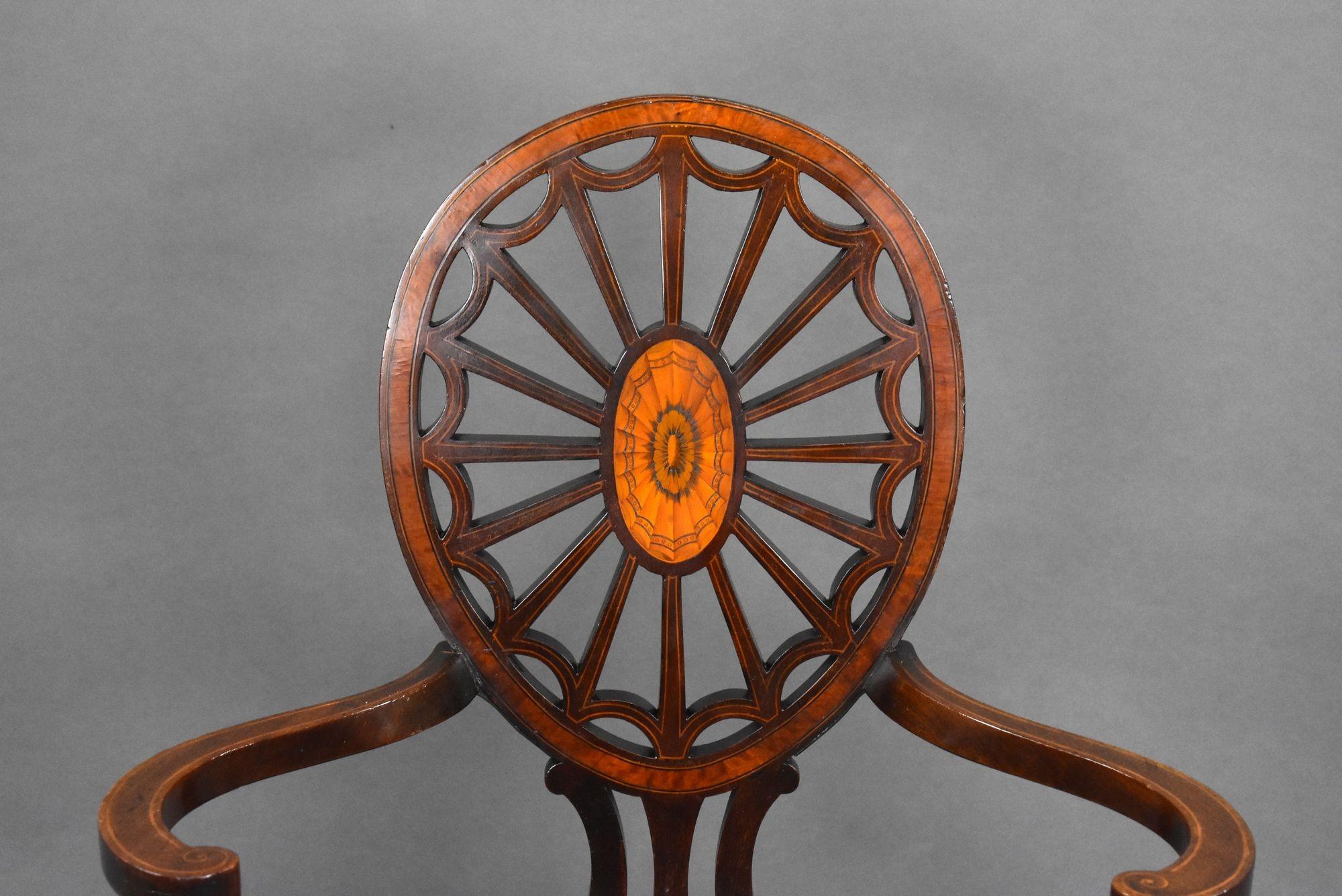 Antique Edwardian Mahogany Armchair with Inlaid Wheel Back – c.1900
Step into timeless elegance with this exquisite Edwardian Mahogany Armchair, dating from around 1900. This piece showcases the refined craftsmanship of the Edwardian period,