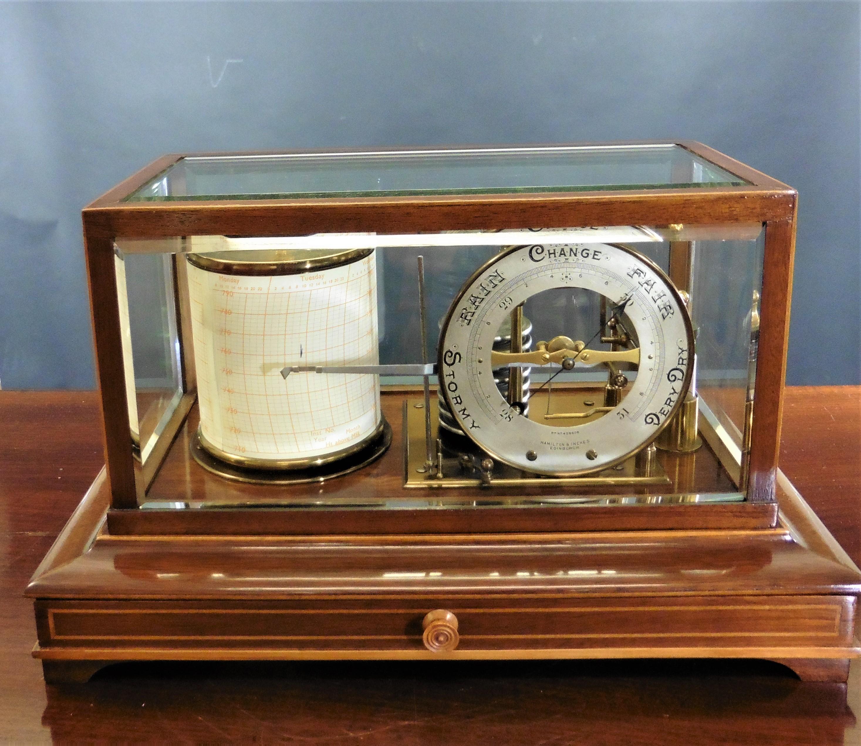 Edwardian Mahogany Barograph by Hamilton and Inches, Edinburgh


Edwardian mahogany Barograph housed in a bevelled glass display case with satinwood line inlay, standing on a raised, moulded plinth and resting on four pad feet.

Eight vacuum
