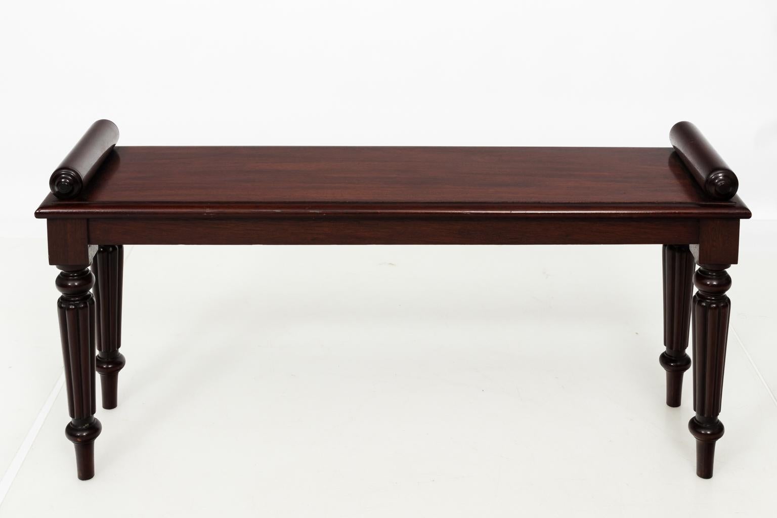 English Edwardian style mahogany bench with arrow turned legs and scrolled arms, circa 1900-1920.
 