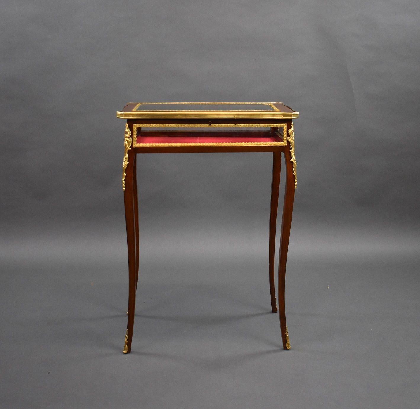 Edwardian French Mahogany Bijouterie/treasure table in good condition. The Table has bevelled glass to the top and glass to the sides with a red velvet lining. The table has ormolu mounts on each corner and each leg.