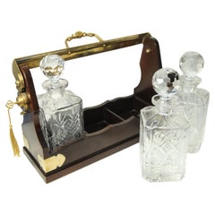 Edwardian Mahogany & Brass Tantalus With A Set of Three Square Glass Decanters