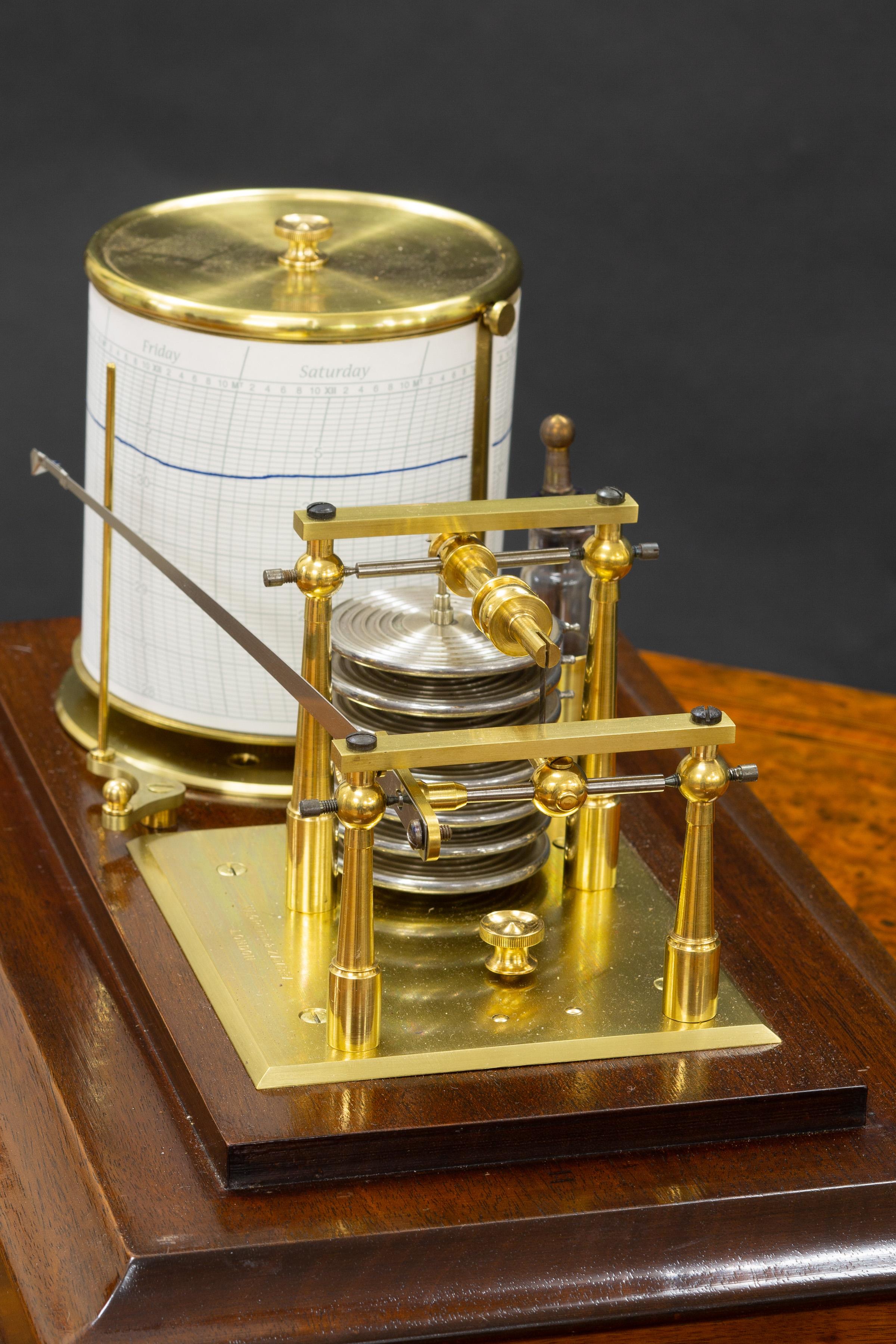 Negretti & Zambra



Fine Edwardian mahogany cased barograph with beveled glass panels and central chart drawer.

Seven vacuum chambers linking the recording arm to the eight day revolving drum with lever escapement.

Original ink bottle and