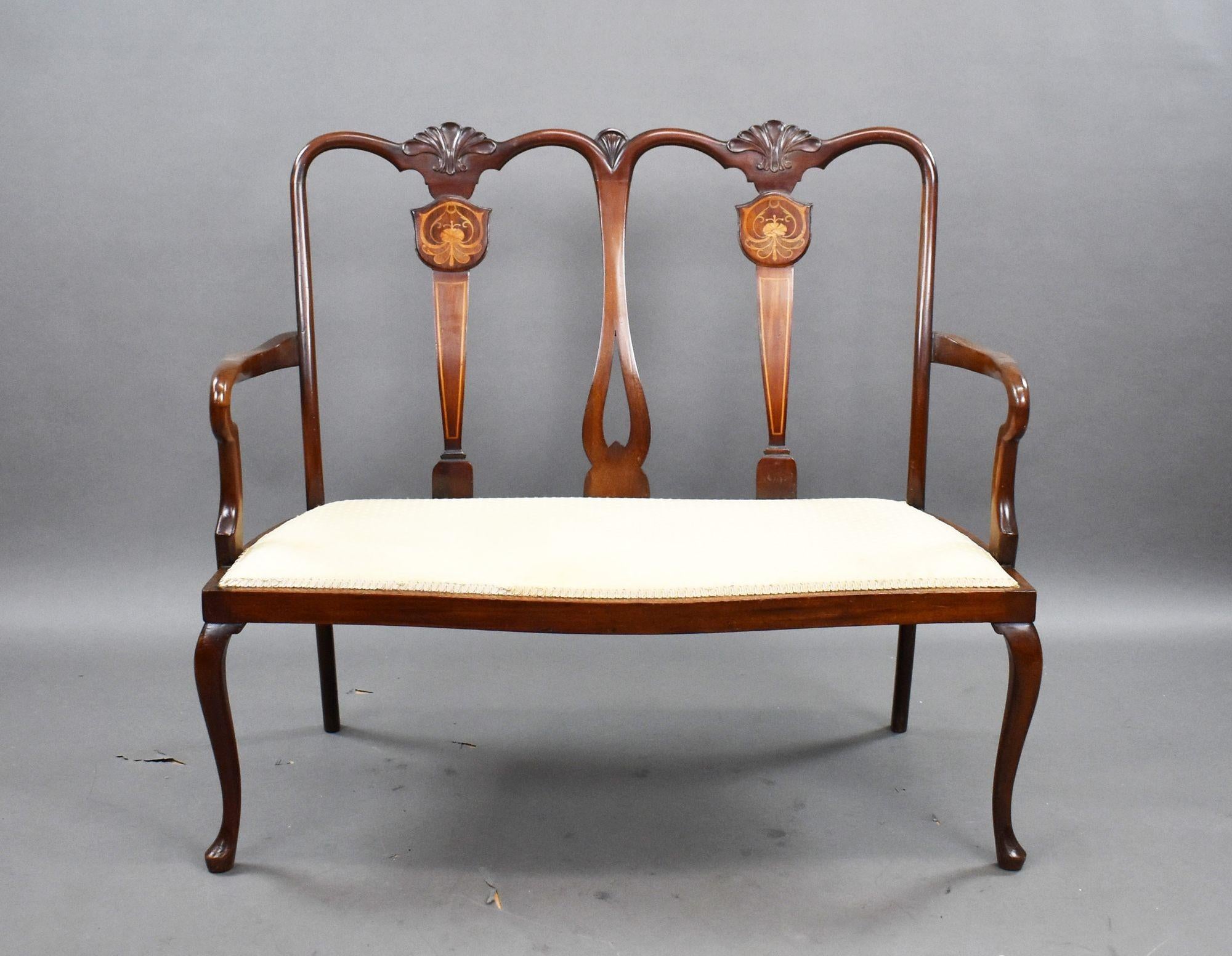 Bring timeless sophistication and refined craftsmanship into your home with this exquisite Edwardian-era mahogany chair-back settee. Handcrafted around 1900, it melds graceful lines, rich wood tones, and subtle inlay details to create a truly