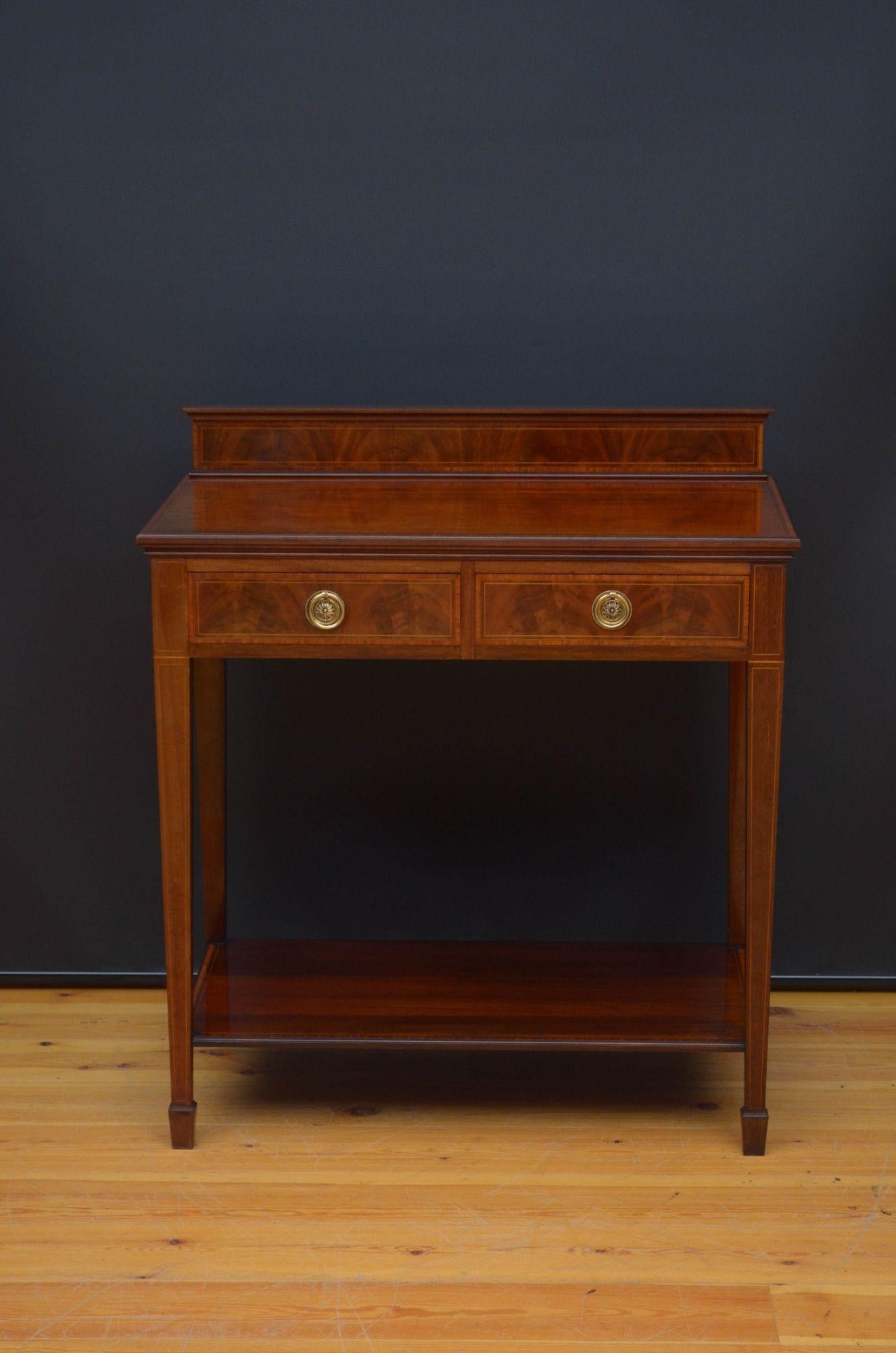 Sn5496 Fine quality Edwardian mahogany server or a console table, having moulded and inlaid upstand to the back edge and a figured mahogany top with satinwood crossbanded and string inlaid edge above two oak lined and crossbanded drawers fitted with