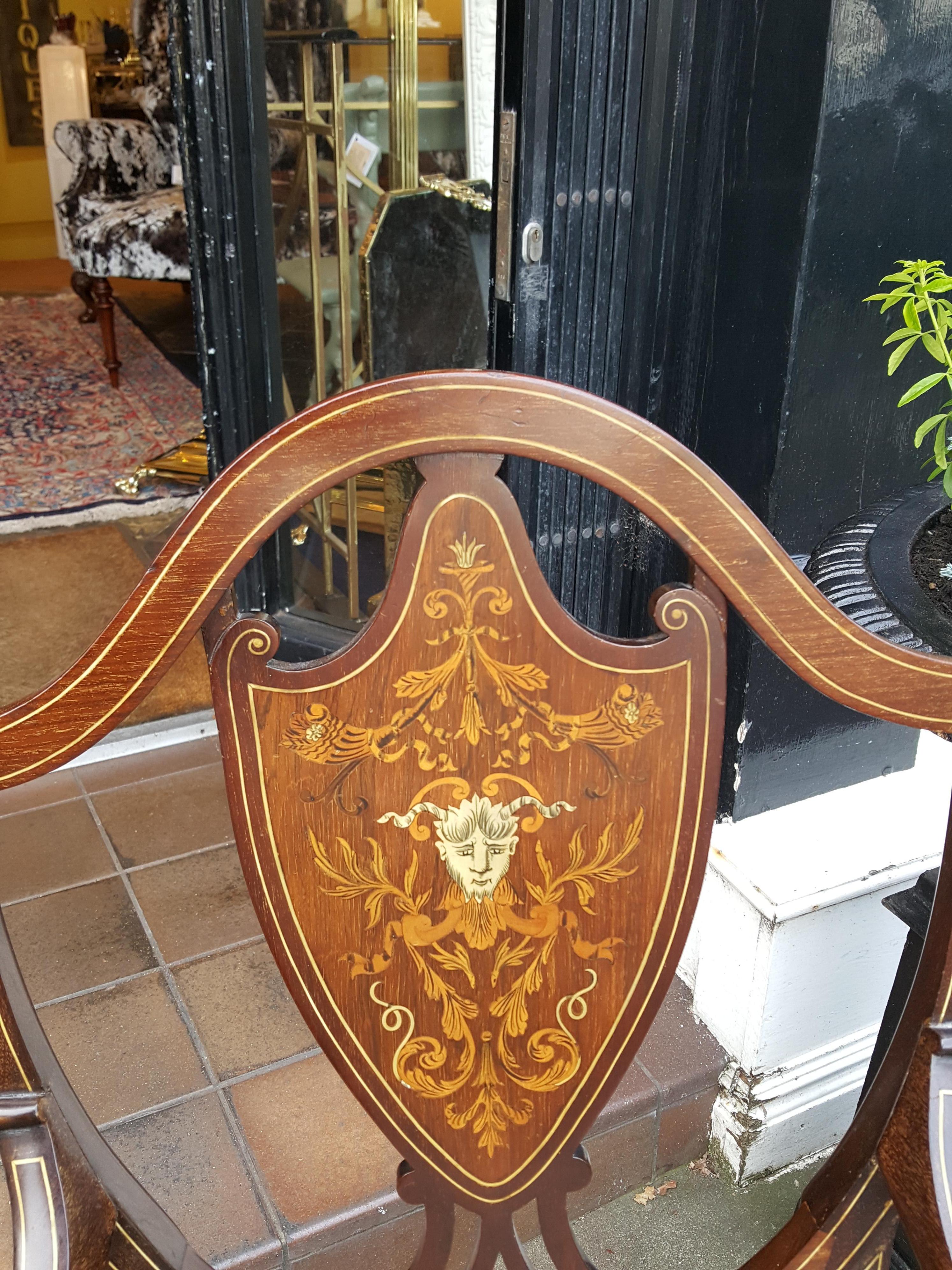 Edwardian mahogany desk chair with finely inlaid back panel depicting Satan in Inferno, of Sheraton form with string inlay
Measures: 21