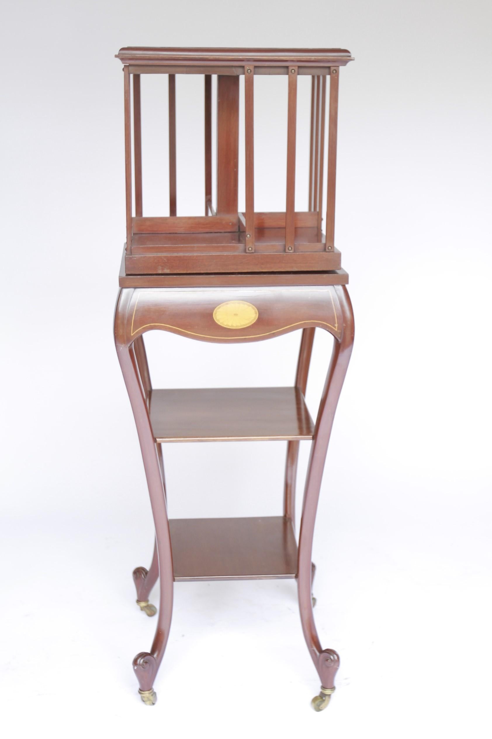 British Edwardian Mahogany inlaid Revolving bookcase on stand For Sale