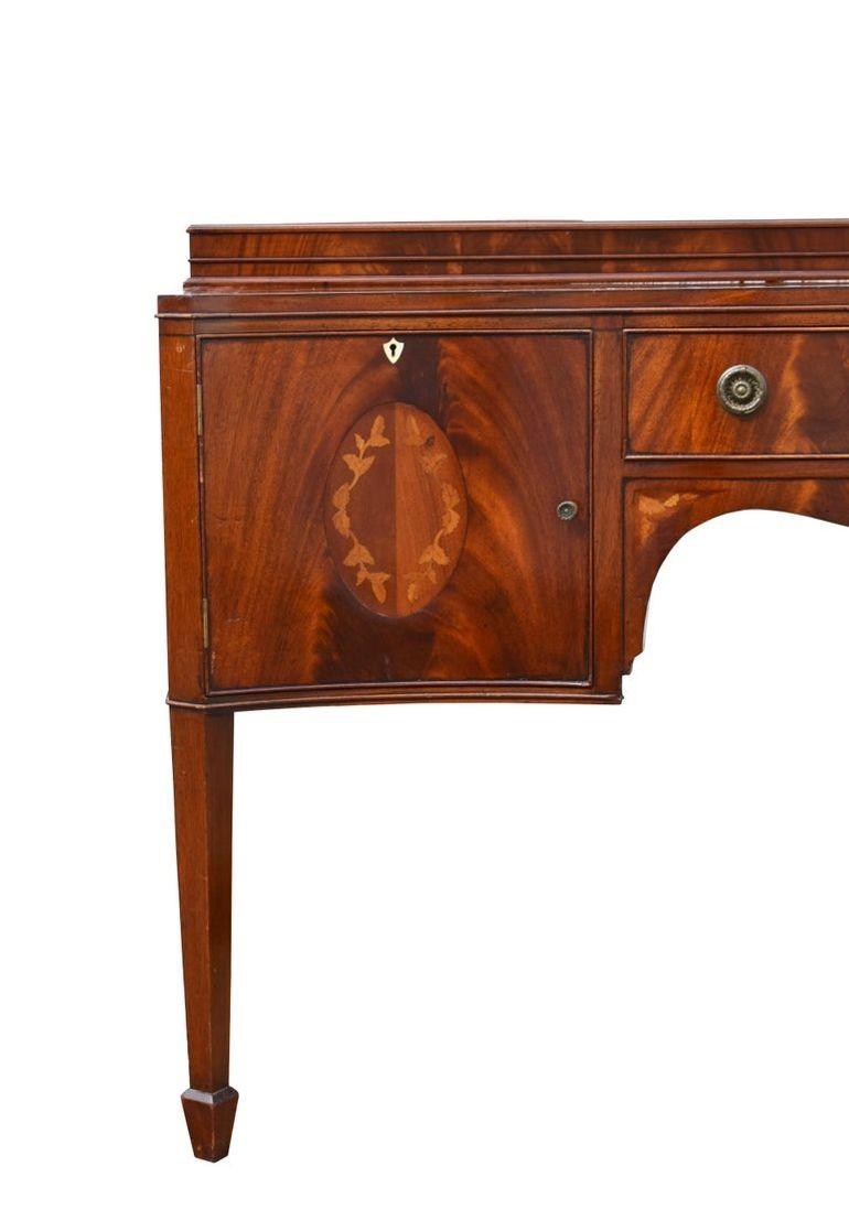 English Edwardian Mahogany Inlaid Serpentine Sideboard For Sale