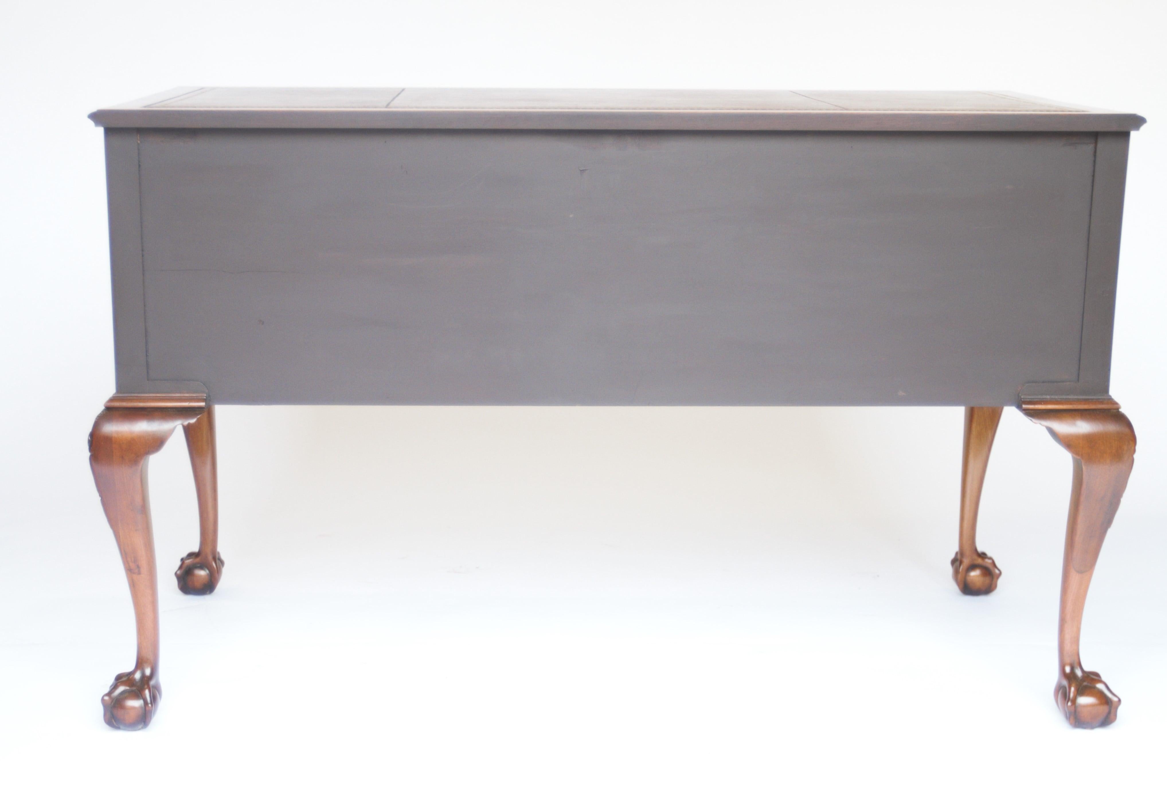 Fine Edwardian Mahogany Kneehole Writing table, 
In The manner of Chippendale
Recently Replaced Burgundy Leather inset top with gold tooling, 
5 drawers with Mahogany linings & fine cut dove tails, 
Gadrooned carved moulding around bottom edge
