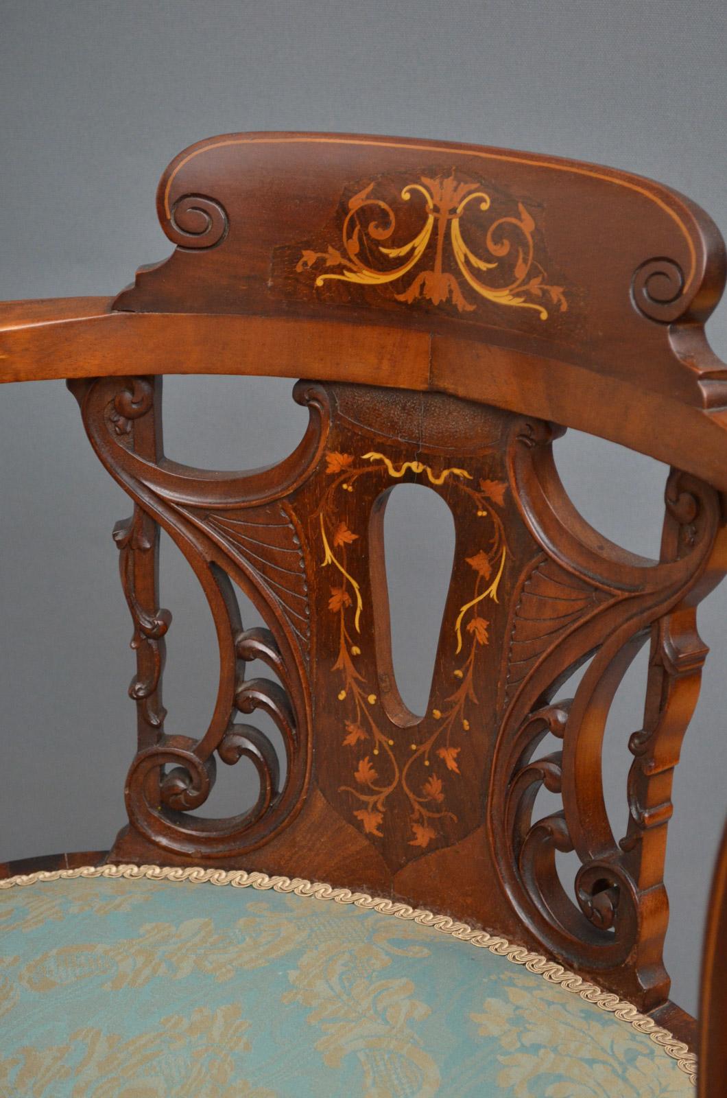 Sn3395 Edwardian mahogany and inlaid tub chair, having inlaid cresting to top rail with finely carved and inlaid back below, open arms on string inlaid supports and circular seat, all standing on slender legs. This armchair retains original finish