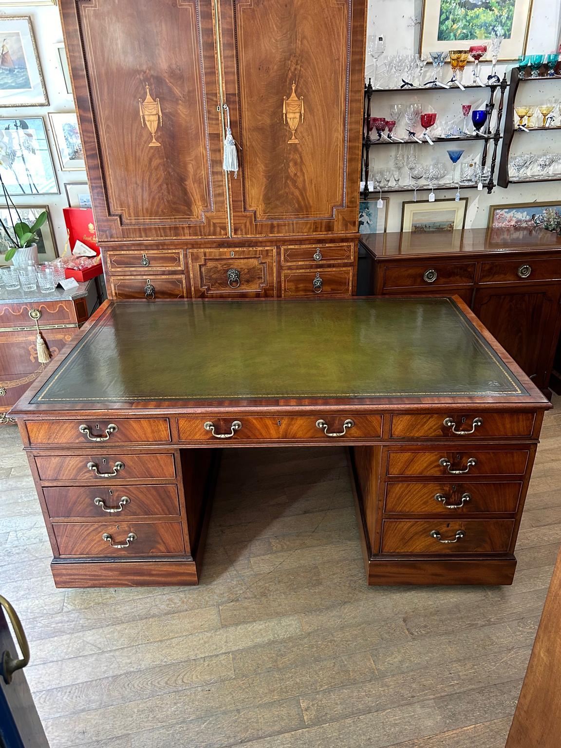 A very high quality Edwardian Mahogany Pedestal Partners Desk with makers plate – S&H Jewell London Cabinet Makers with a high quality hide tooled leathered writing surface. 9 drawers and 2 cupboards with oak lined drawers and original brass swan