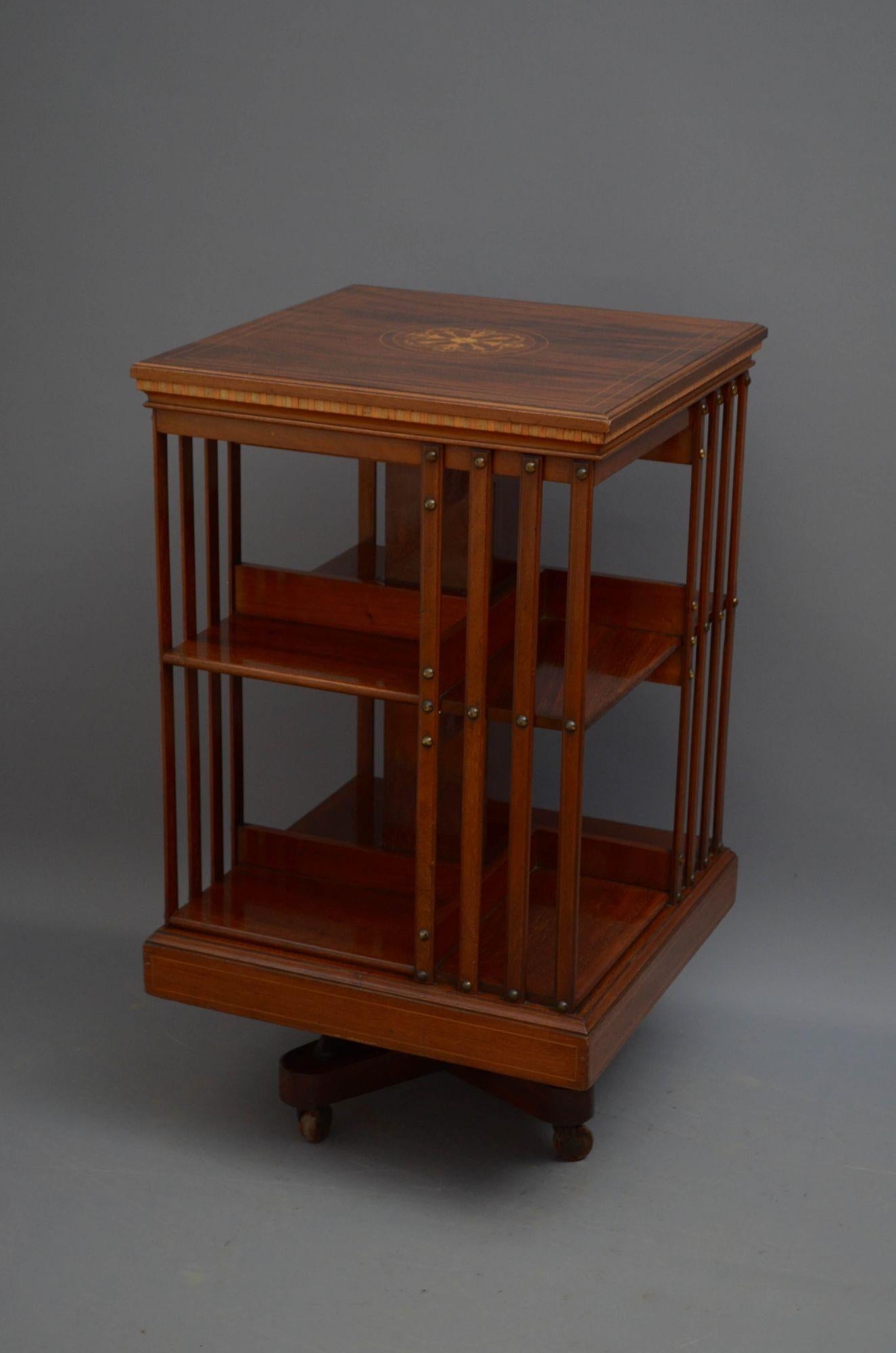 Sn5453 Fine quality Edwardian mahogany and inlaid revolving bookcase, having finely inlaid top with moulded and string inlaid edge above dentil inlaid frieze and four slatted sides, standing on cross stretchers with cast iron support terminating in