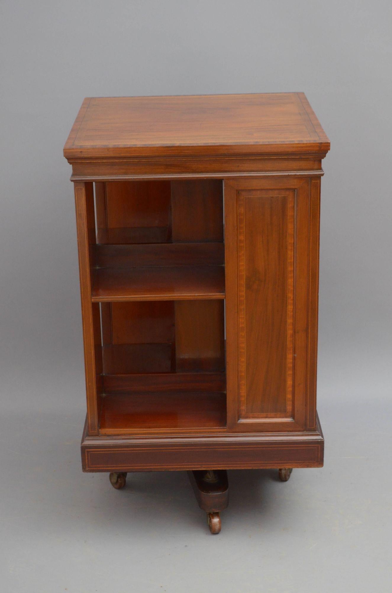 Sn5494 Fine quality Edwardian revolving bookcase in mahogany, having figured mahogany top with satinwood crossbanded edge above four storage section each with bling panel also crossbanded in satinwood, all standing on X cross base with cart iron