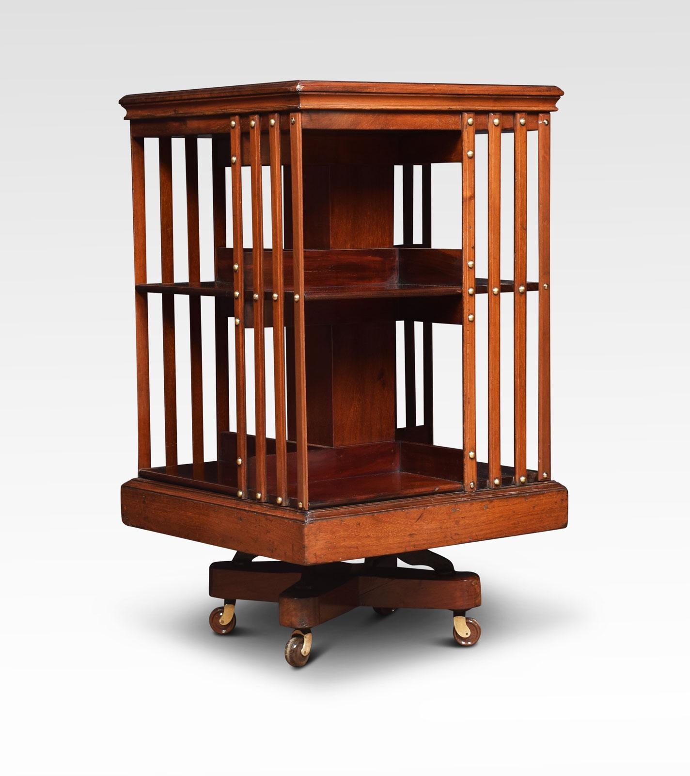 Mahogany revolving bookcase the square top with moulded edge, above an arrangement off shelves raised up on a metal cruciform base with castors.
Dimensions
Height 33.5 inches
Length 19.5 inches
width 19.5 inches.