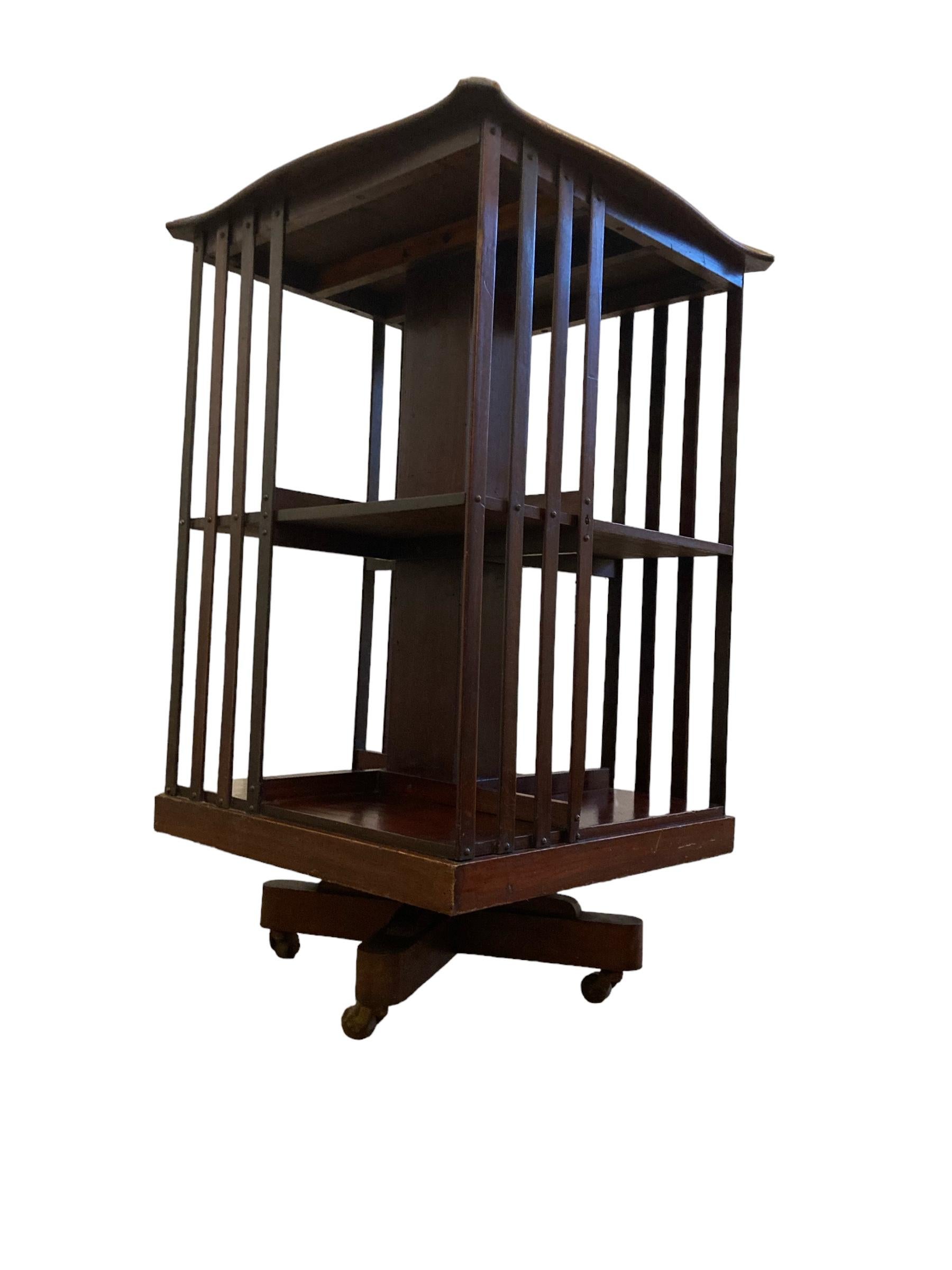 Edwardian Mahogany revolving Bookcase on casters and slatted supports is a perfect addition to any space. Crafted with high-quality Mahogany wood, it offers both functionality and style. The shelves provide ample storage for books, decor, or other