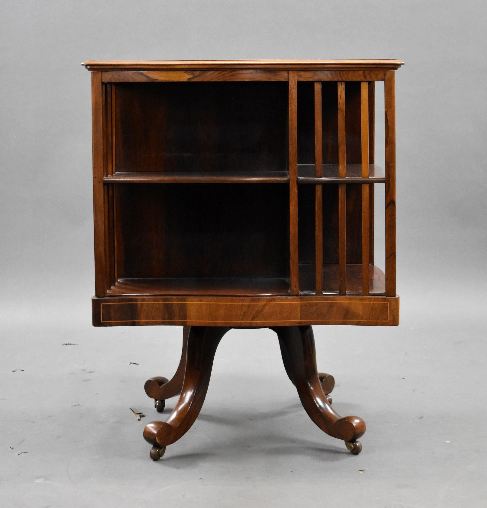 Edwardian Mahogany Revolving Bookstand, dating from around 1900. Beautifully crafted from solid mahogany, this piece showcases the refined workmanship and tasteful design of the Edwardian period.
Featuring a square top with delicate inlaid detailing
