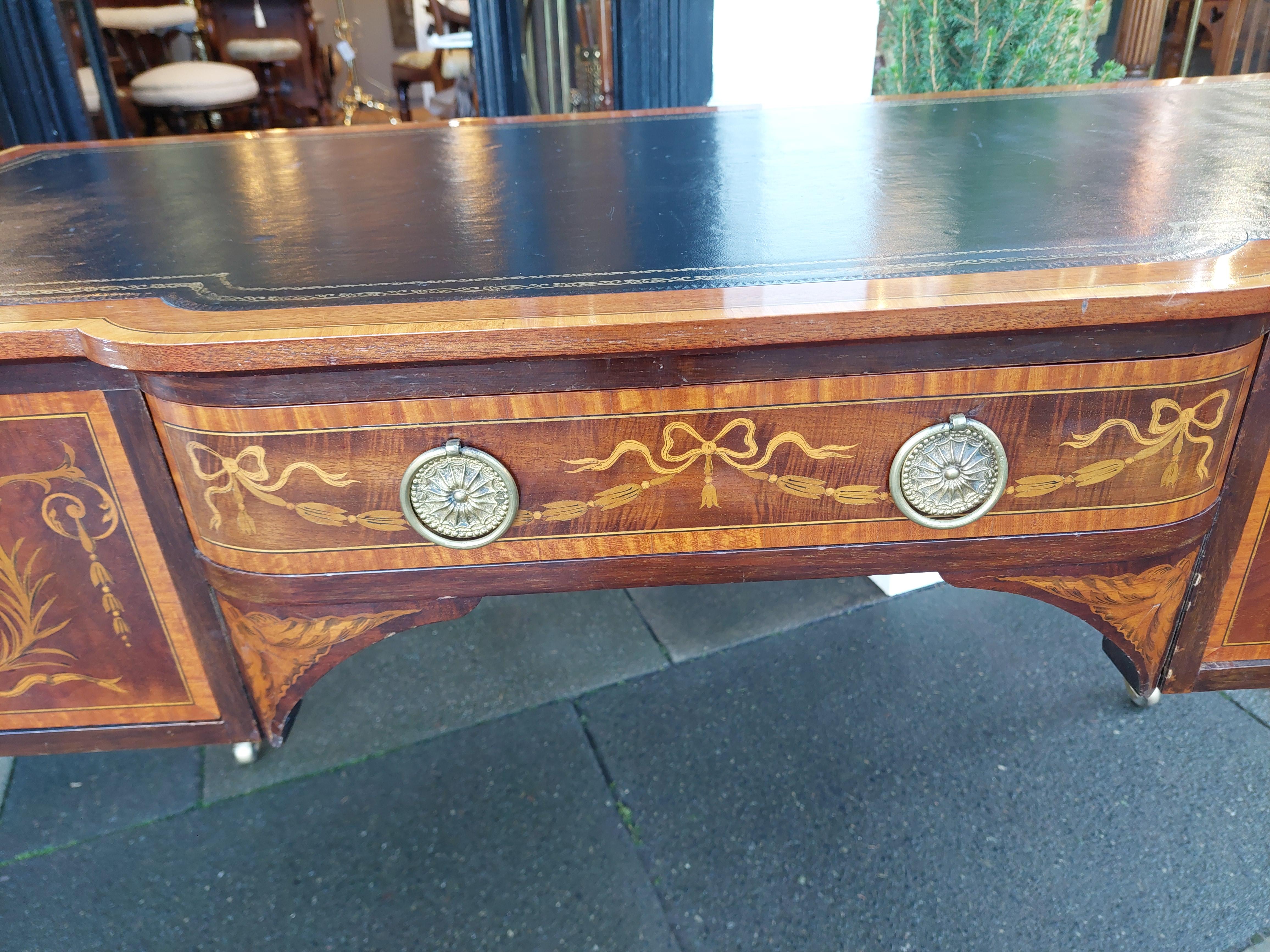 Edwardian Mahogany Sheraton Style Desk
with Dyed Sycamore Scroll, Swag and Bellflower Inlays, Inset Tooled Leather Top on Square Tapered Legs and Brass Castors - 48