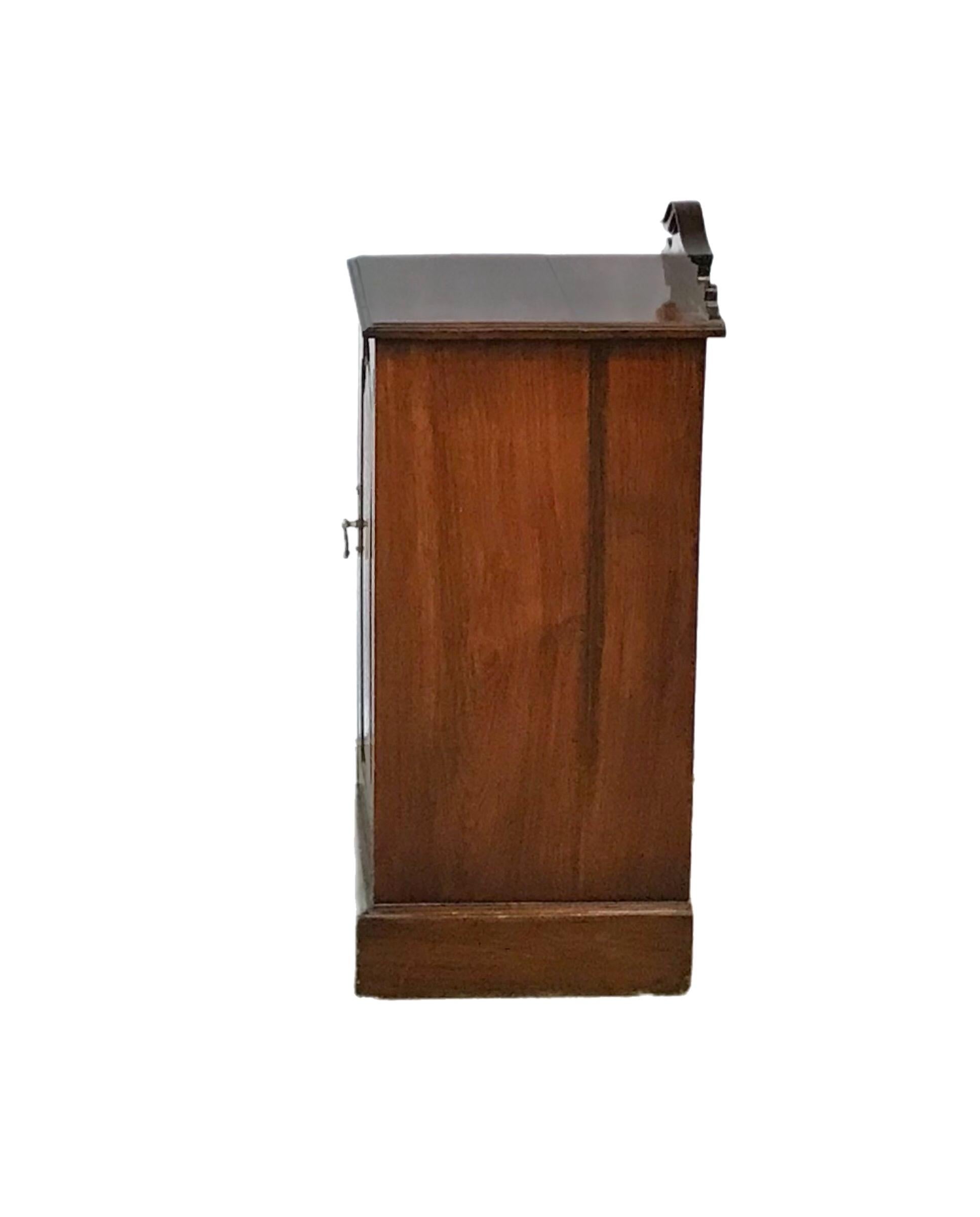 Deep rich mahogany finish gives this piece a beautiful appearance. The back panel allows for air circulation with the multiple drillings.